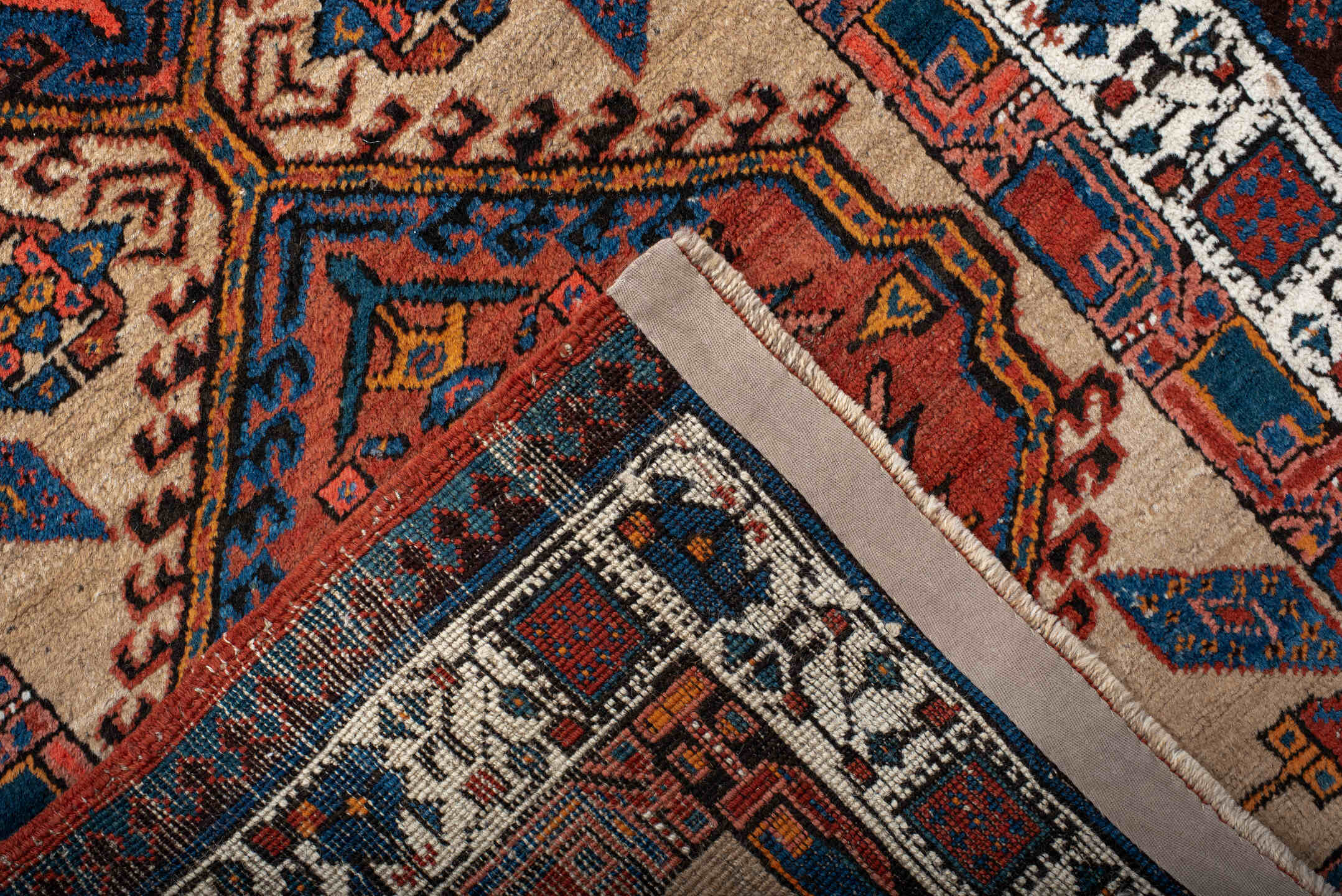 3' x 8' one-of-a-kind handmade antique Sarab runner rug. Color palette: ivory, indigo, rust, navy, terra cotta, camel
