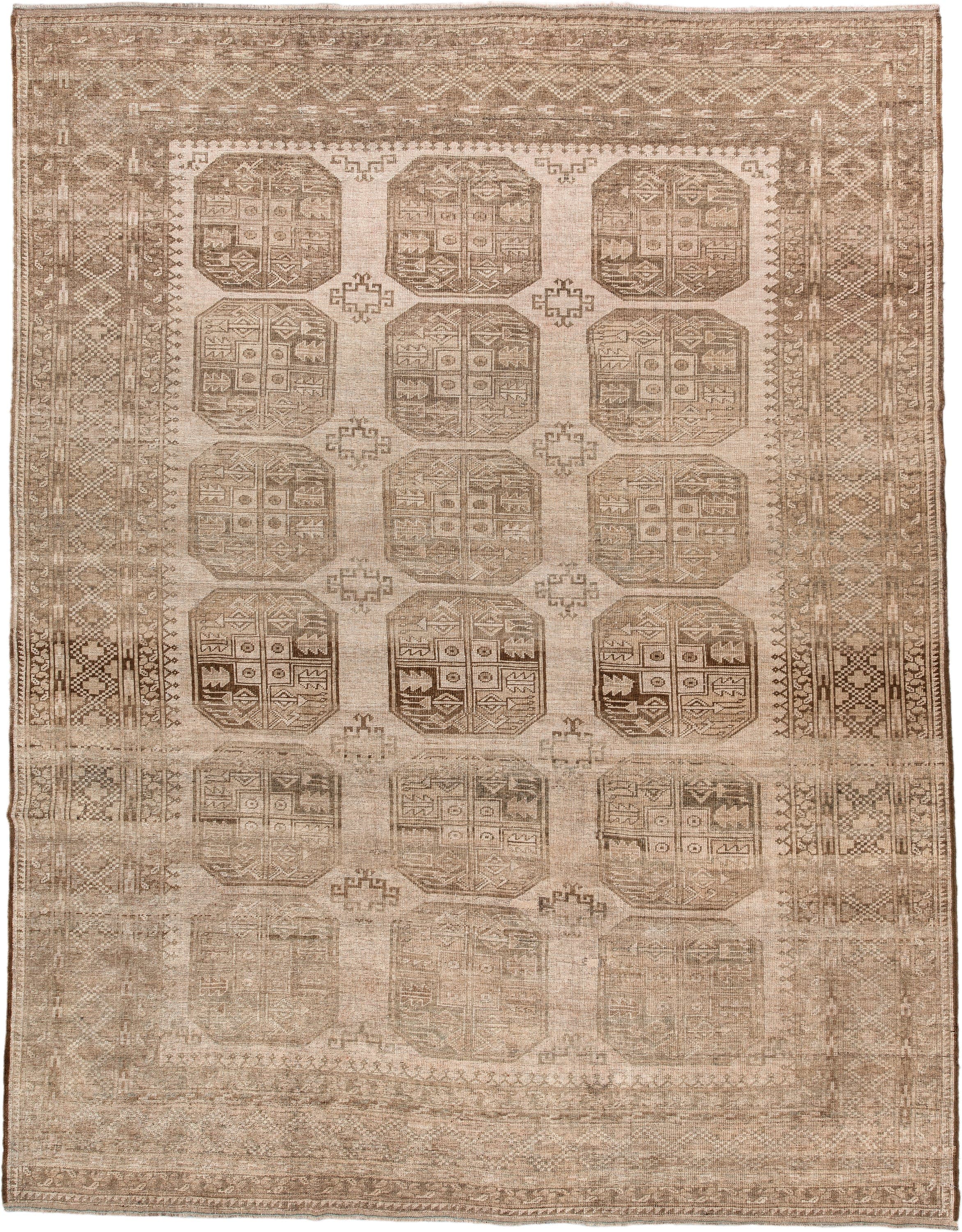 7' x 9' one-of-a-kind handmade antique Afghan large size rug. Color palette: taupe, beige, camel, ivory, brown, gray