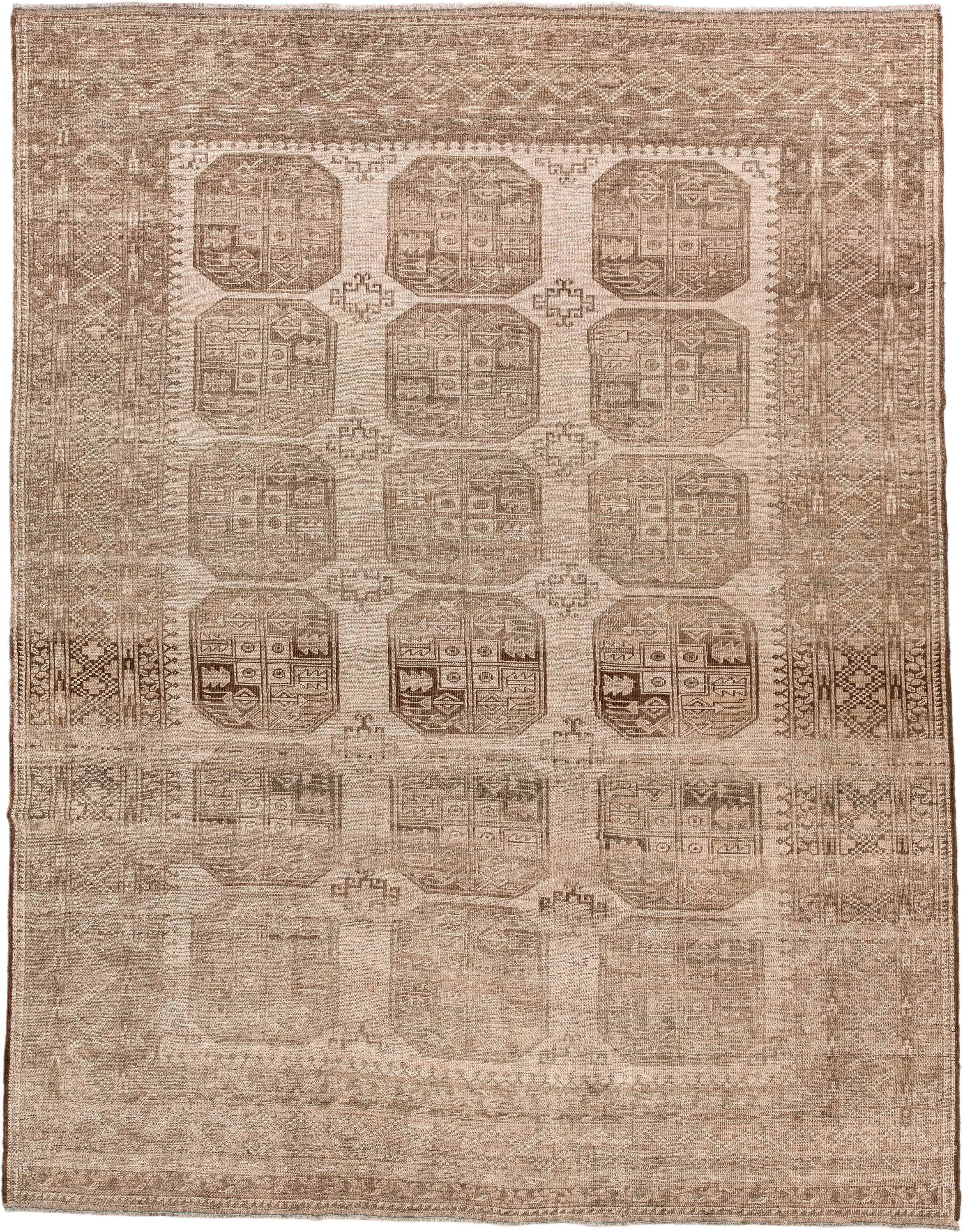 7' x 9' one-of-a-kind handmade antique Afghan large size rug. Color palette: taupe, beige, camel, ivory, brown, gray