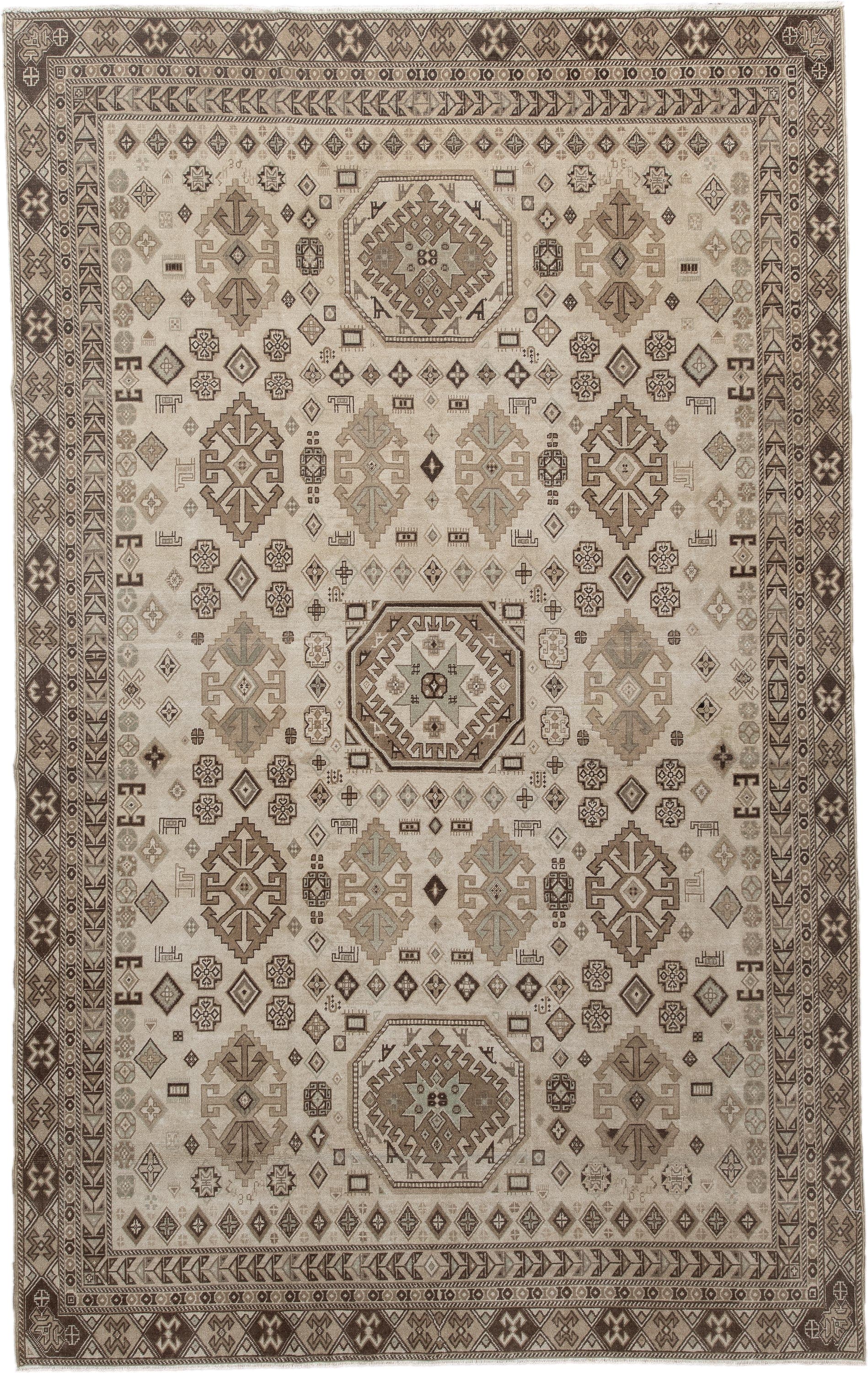 5' x 9' one-of-a-kind handmade vintage Ardebil medium size rug. Color palette: ivory, taupe, brown, camel, charcoal, greige