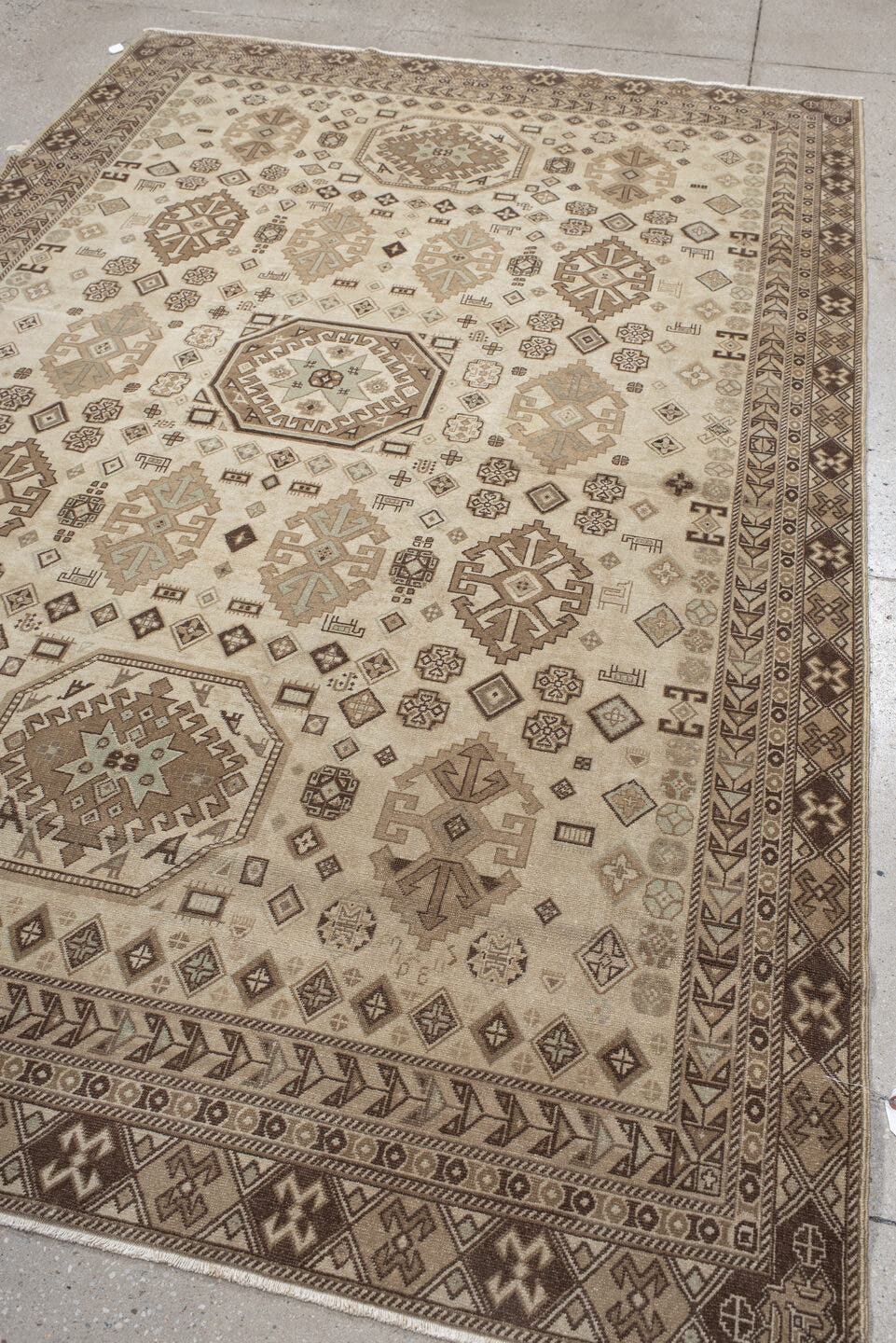 5' x 9' one-of-a-kind handmade vintage Ardebil medium size rug. Color palette: ivory, taupe, brown, camel, charcoal, greige