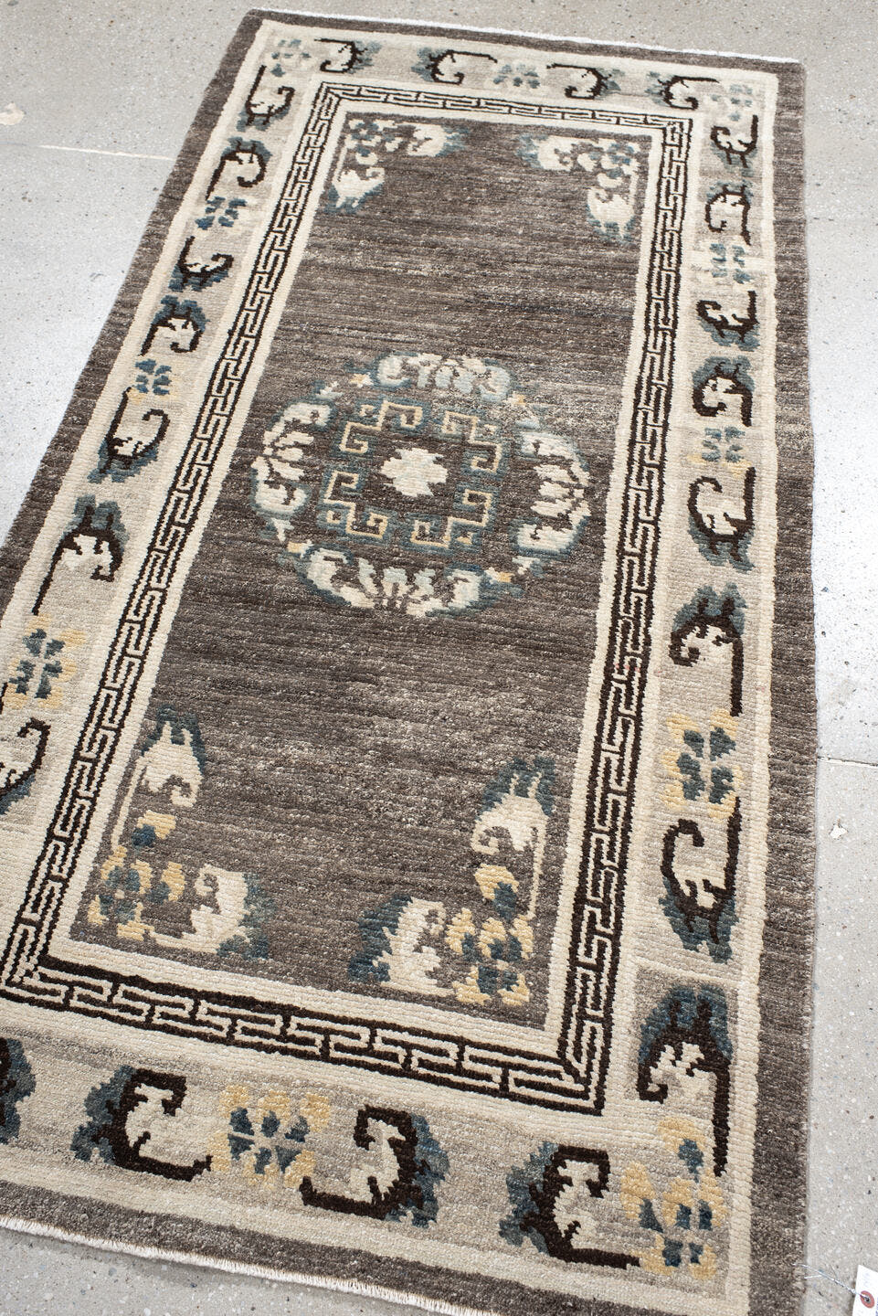 3' x 6' one-of-a-kind handmade antique Tibetan runner rug. Color palette: taupe, ivory, charcoal, slate, cream, gold, beige