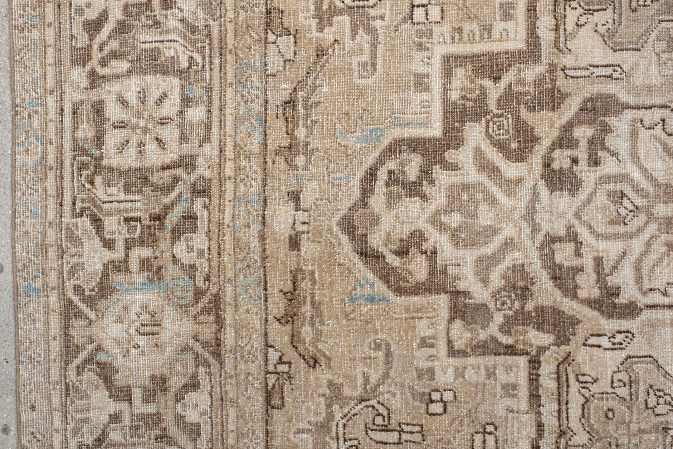 7' x 10' one-of-a-kind handmade antique Heriz large size rug. Color palette: ivory, taupe, beige, brown, camel, pale blue