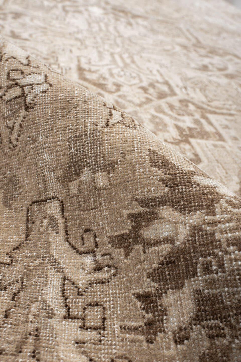 7' x 10' one-of-a-kind handmade antique Heriz large size rug. Color palette: ivory, taupe, beige, brown, camel, pale blue