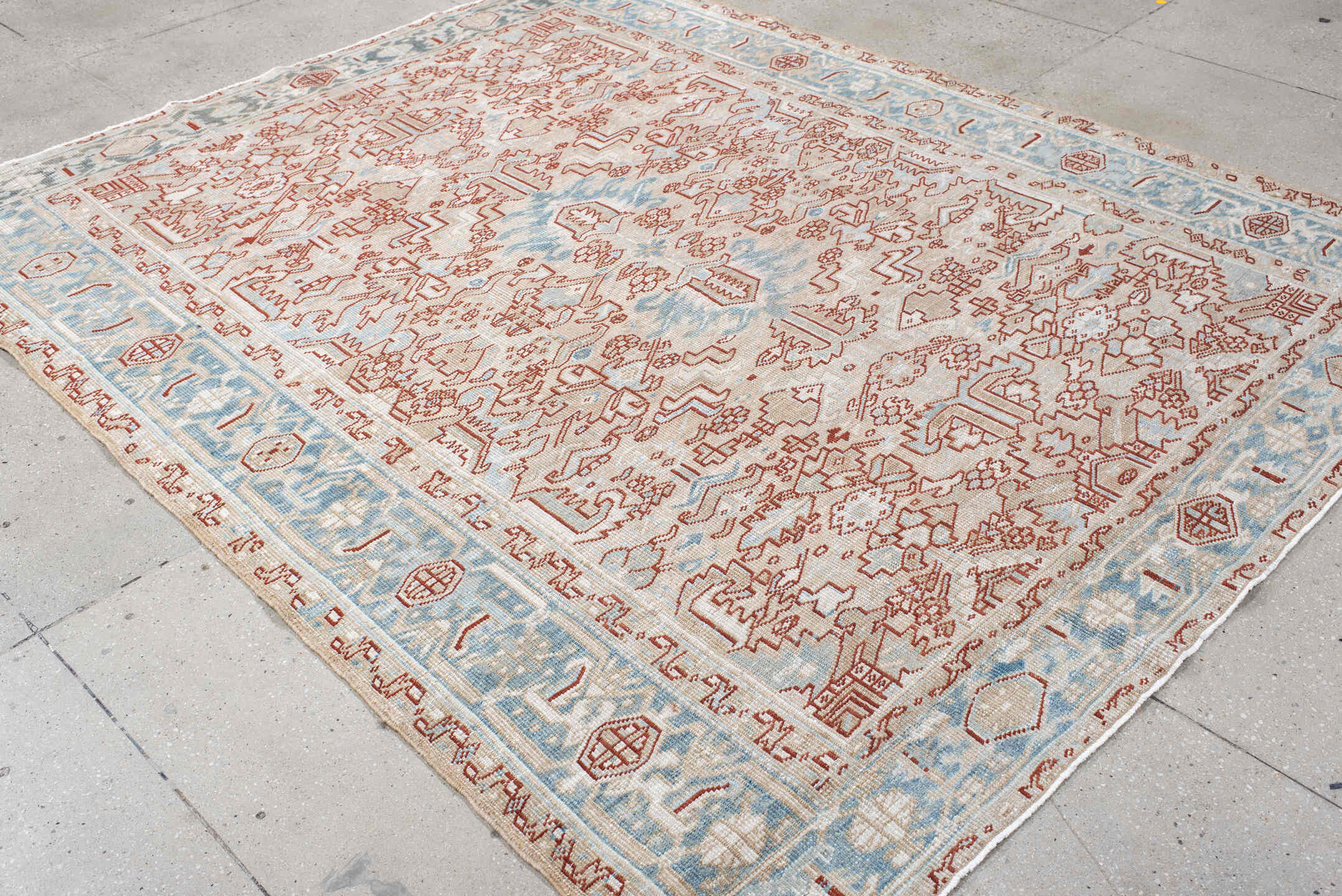 6' x 8' one-of-a-kind handmade antique Heriz medium size rug. Color palette: ivory, sky_blue, terracotta, pale_blue, rust
