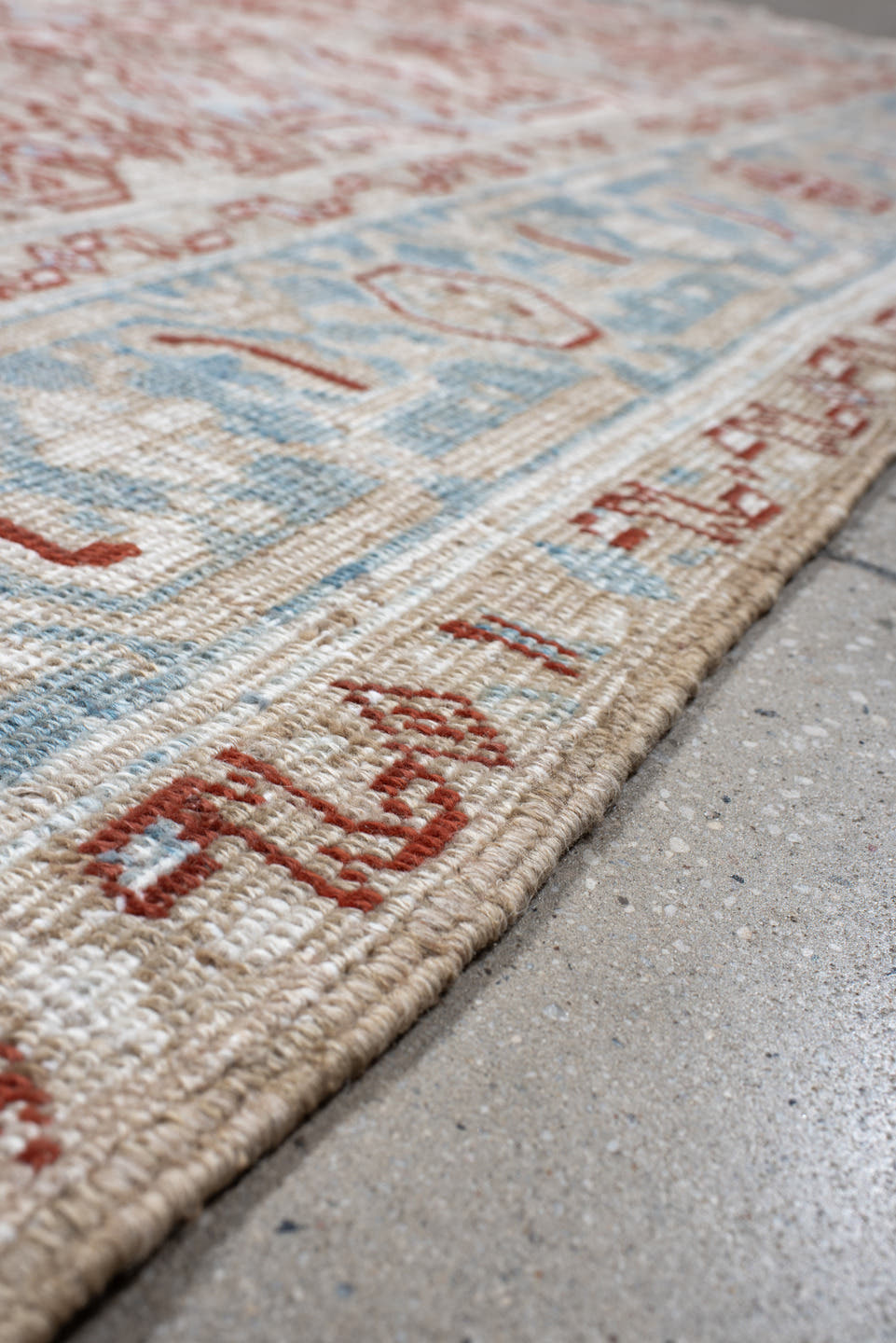 6' x 8' one-of-a-kind handmade antique Heriz medium size rug. Color palette: ivory, sky_blue, terracotta, pale_blue, rust