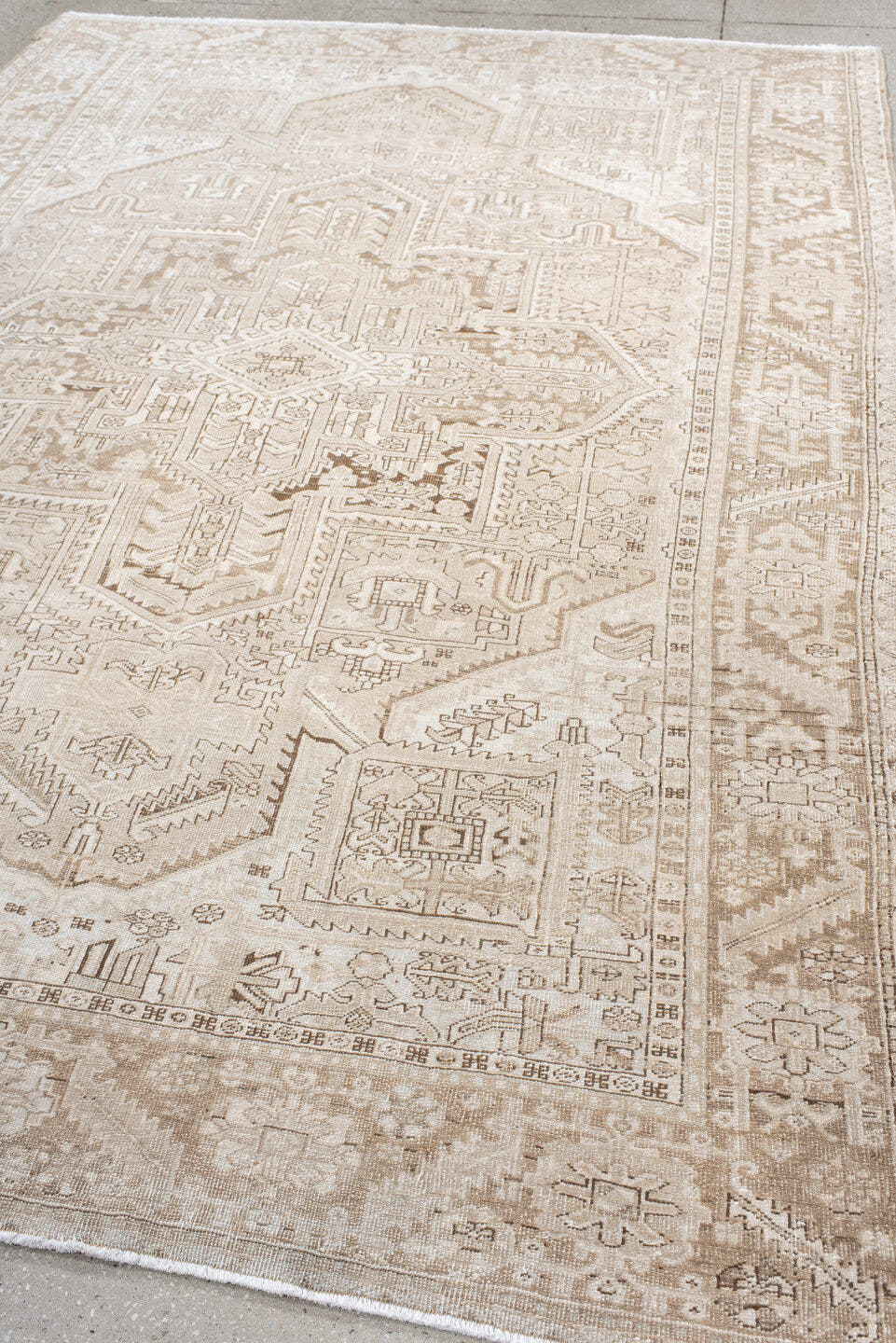 6' x 9' one-of-a-kind handmade antique Heriz medium size rug. Color palette: ivory, taupe, beige, sand, camel, gray