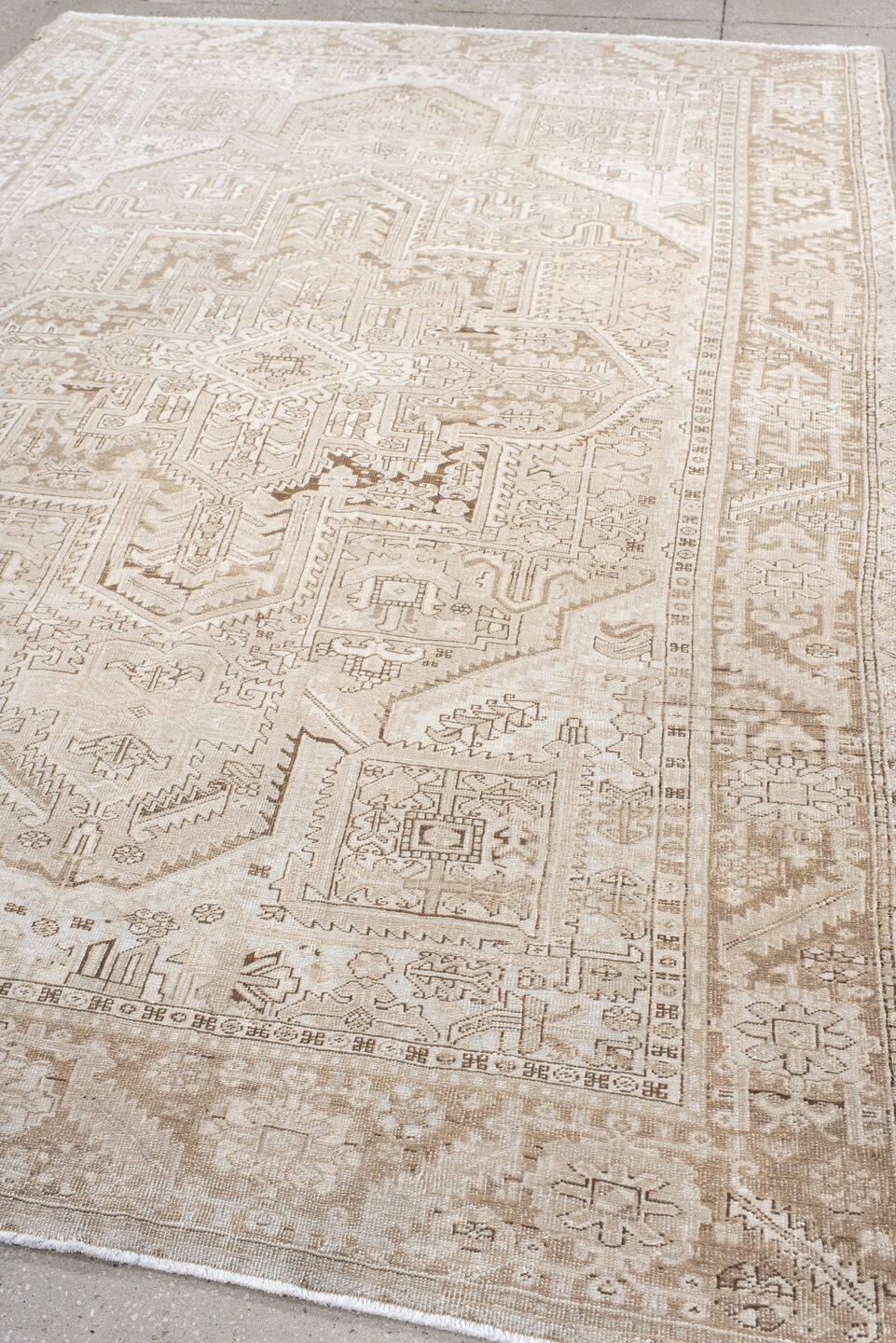 6' x 9' one-of-a-kind handmade antique Heriz medium size rug. Color palette: ivory, taupe, beige, sand, camel, gray