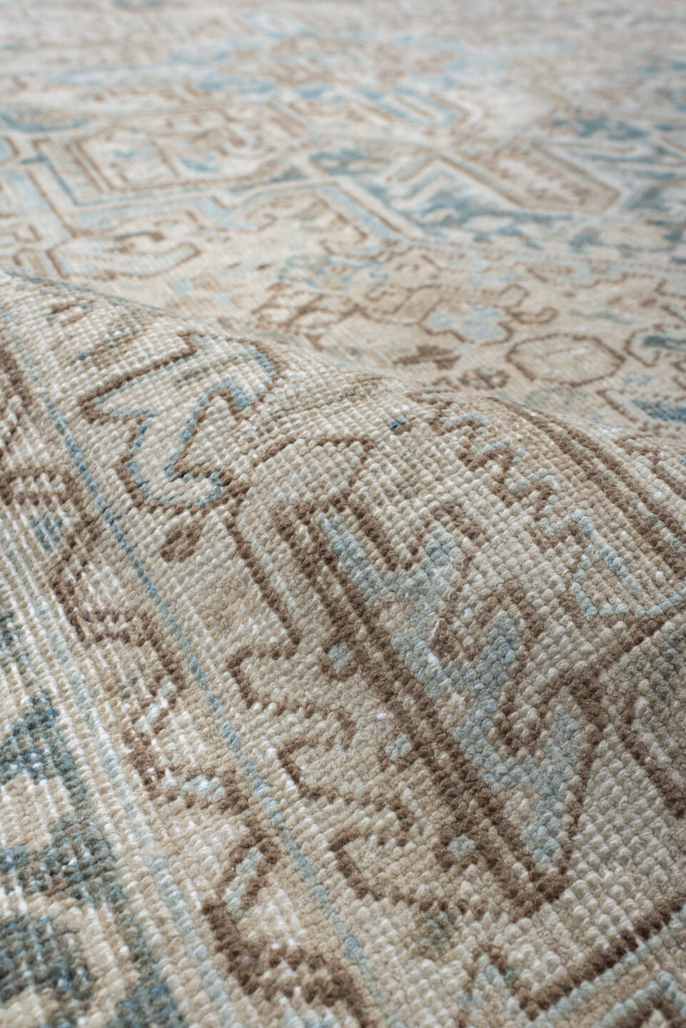 6' x 9' one-of-a-kind handmade antique Heriz medium size rug. Color palette: ivory, sky blue, taupe, beige, slate, camel