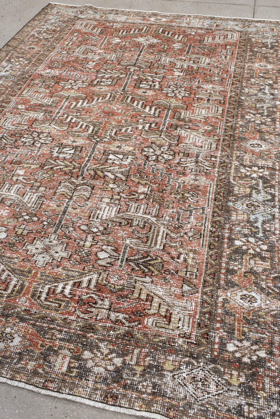 6' x 8' one-of-a-kind handmade antique Heriz medium size rug. Color palette: terra cotta, ivory, taupe, brown, charcoal