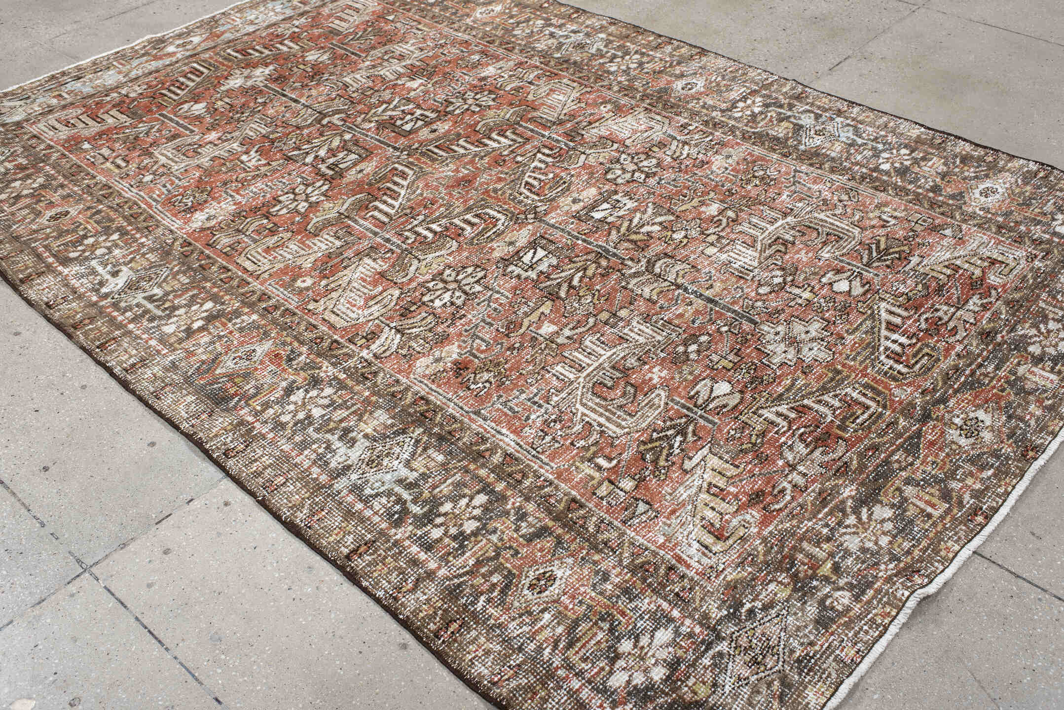 6' x 8' one-of-a-kind handmade antique Heriz medium size rug. Color palette: terra cotta, ivory, taupe, brown, charcoal