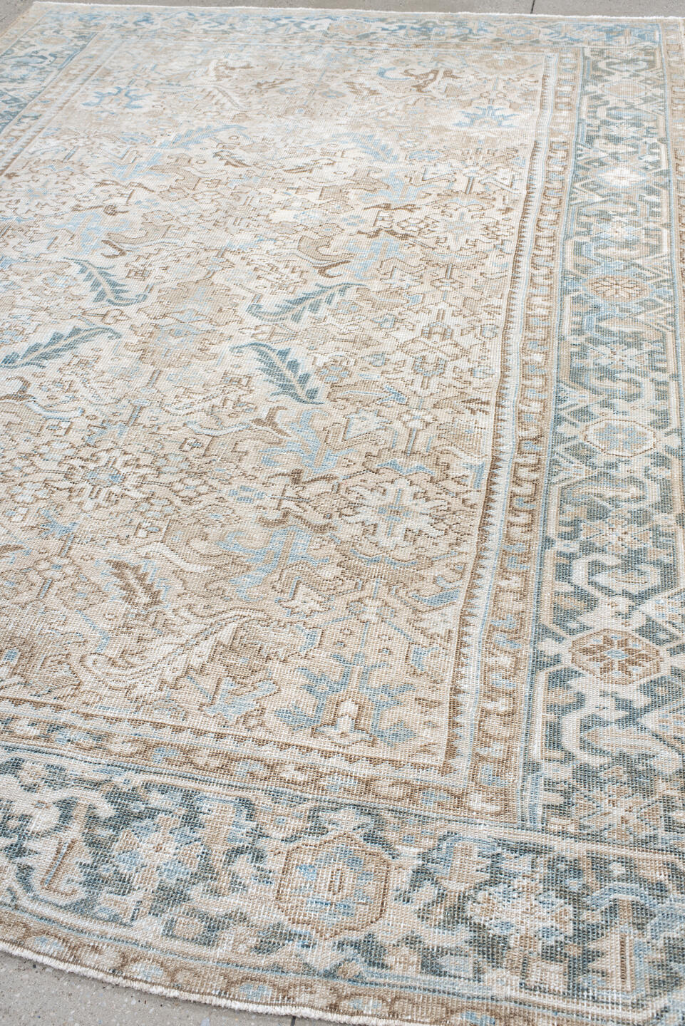7' x 10' one-of-a-kind handmade antique Heriz large size rug. Color palette: ivory, light blue, taupe, beige, cream, gray