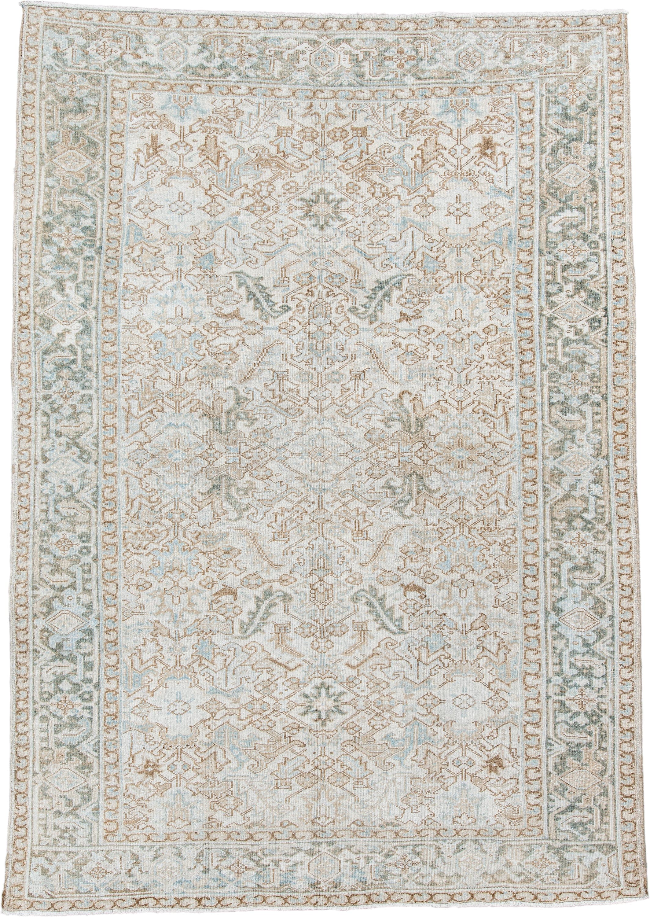 7' x 11' one-of-a-kind handmade antique Heriz large size rug. Color palette: ivory, pale aqua, camel, taupe, sage, cream