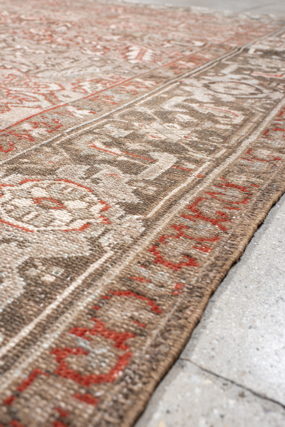 7' x 10' one-of-a-kind handmade antique Heriz large size rug. Color palette: taupe, ivory, charcoal, coral, brown, gray