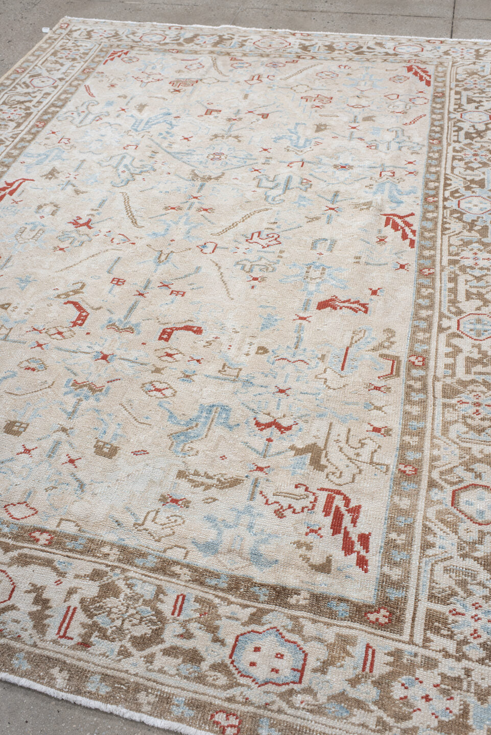 6' x 8' one-of-a-kind handmade antique Heriz medium size rug. Color palette: ivory, taupe, light blue, rust, beige, gray