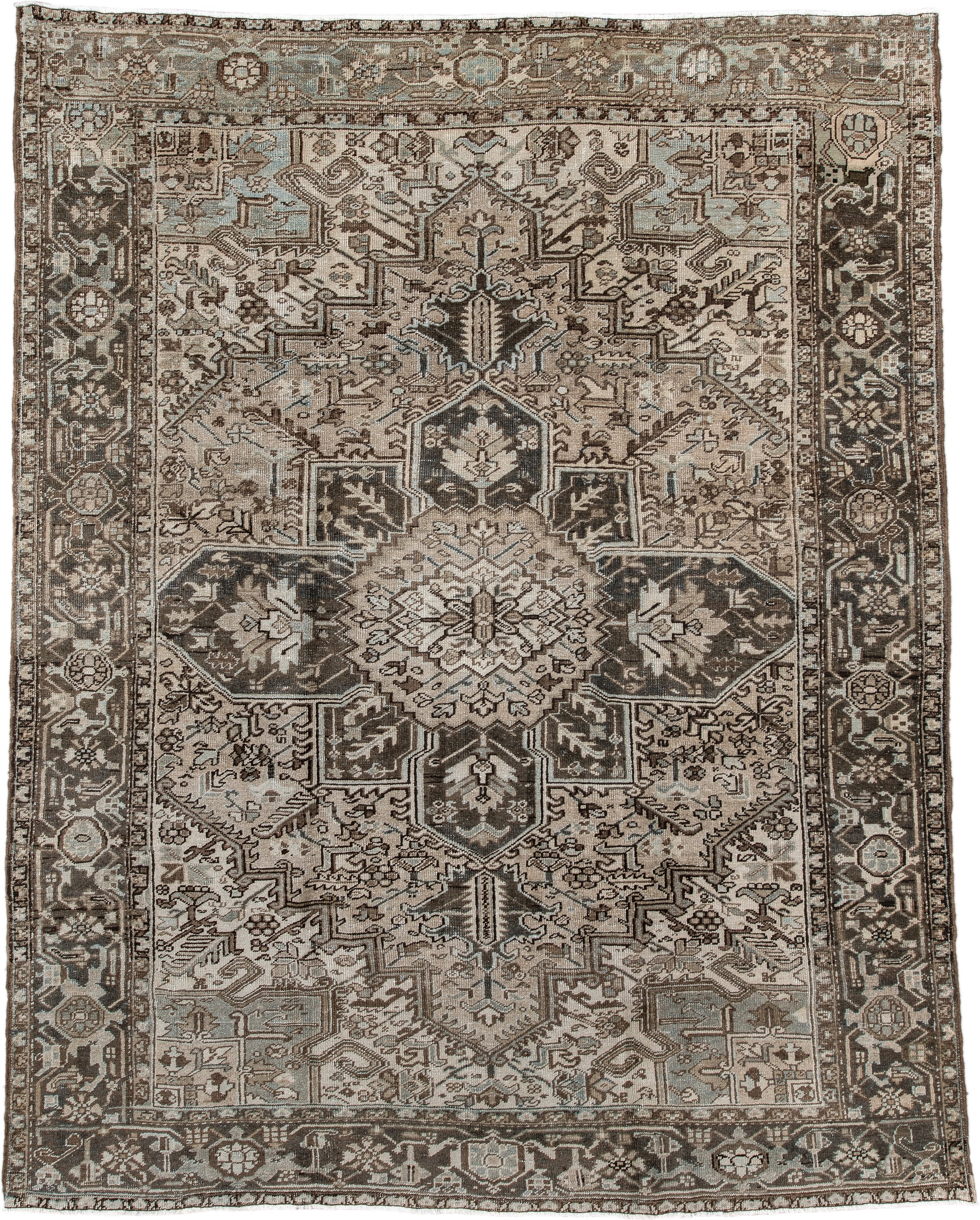 7' x 9' one-of-a-kind handmade antique Heriz large size rug. Color palette: taupe, charcoal, ivory, camel, slate, brown
