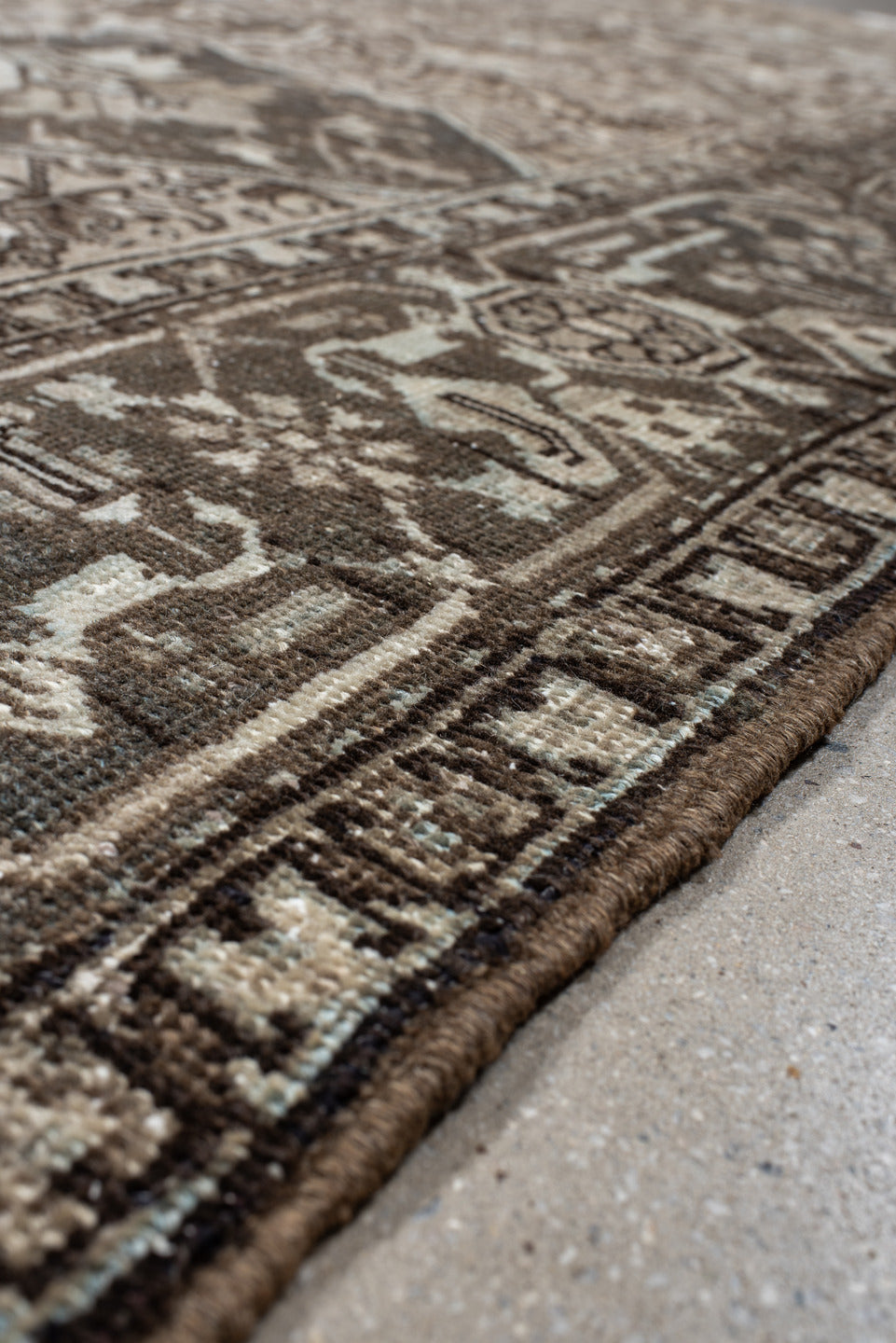 7' x 9' one-of-a-kind handmade antique Heriz large size rug. Color palette: taupe, charcoal, ivory, camel, slate, brown