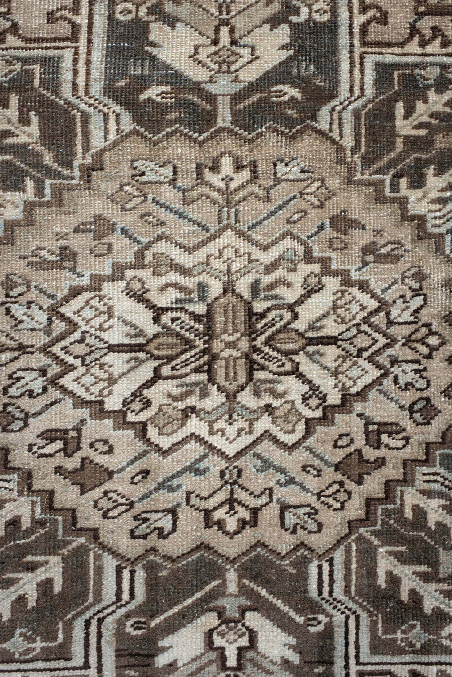 7' x 9' one-of-a-kind handmade antique Heriz large size rug. Color palette: taupe, charcoal, ivory, camel, slate, brown