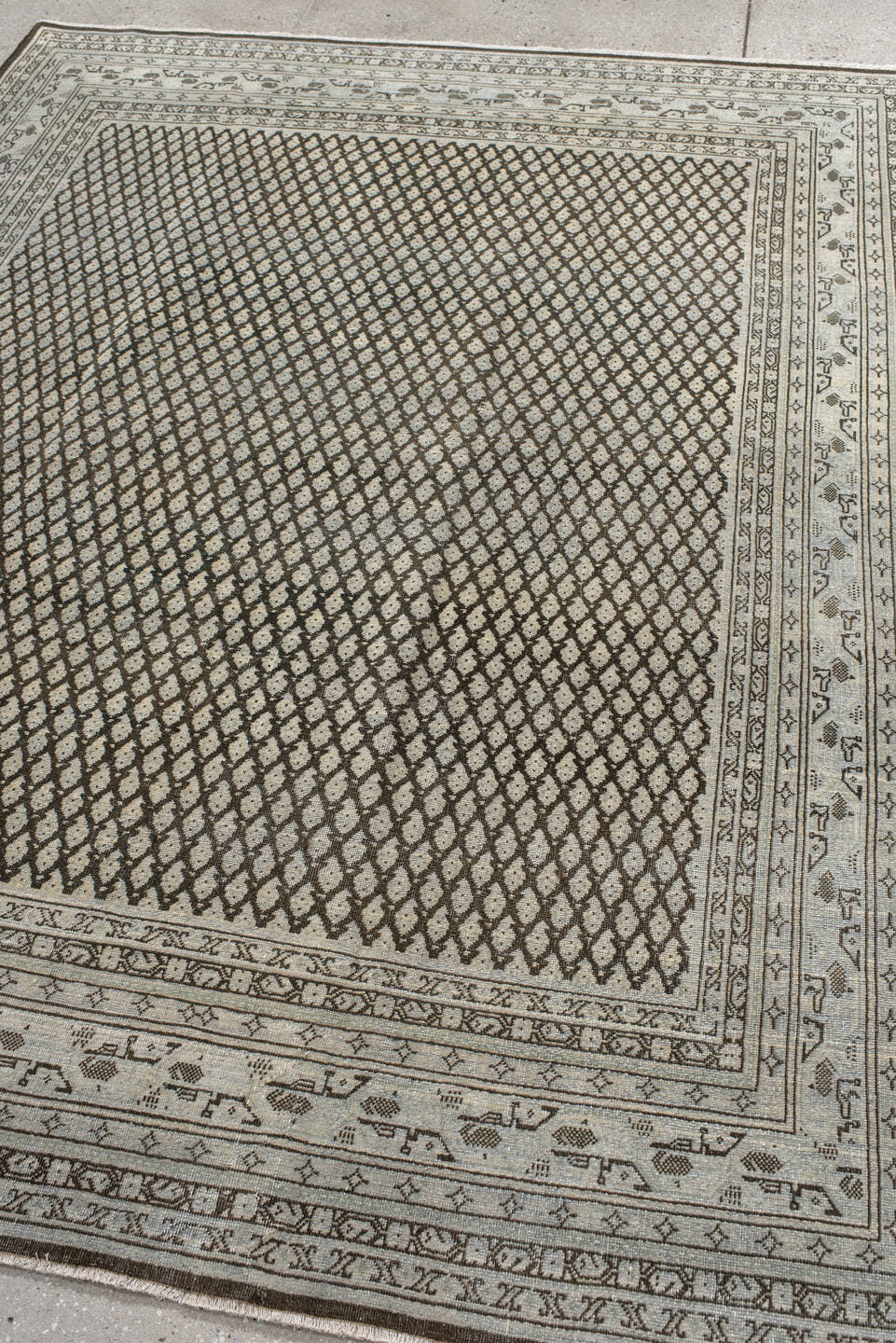 6' x 7' one-of-a-kind handmade antique Mir rug. Color palette: ivory, brown, taupe, camel, charcoal, beige, gray, black
