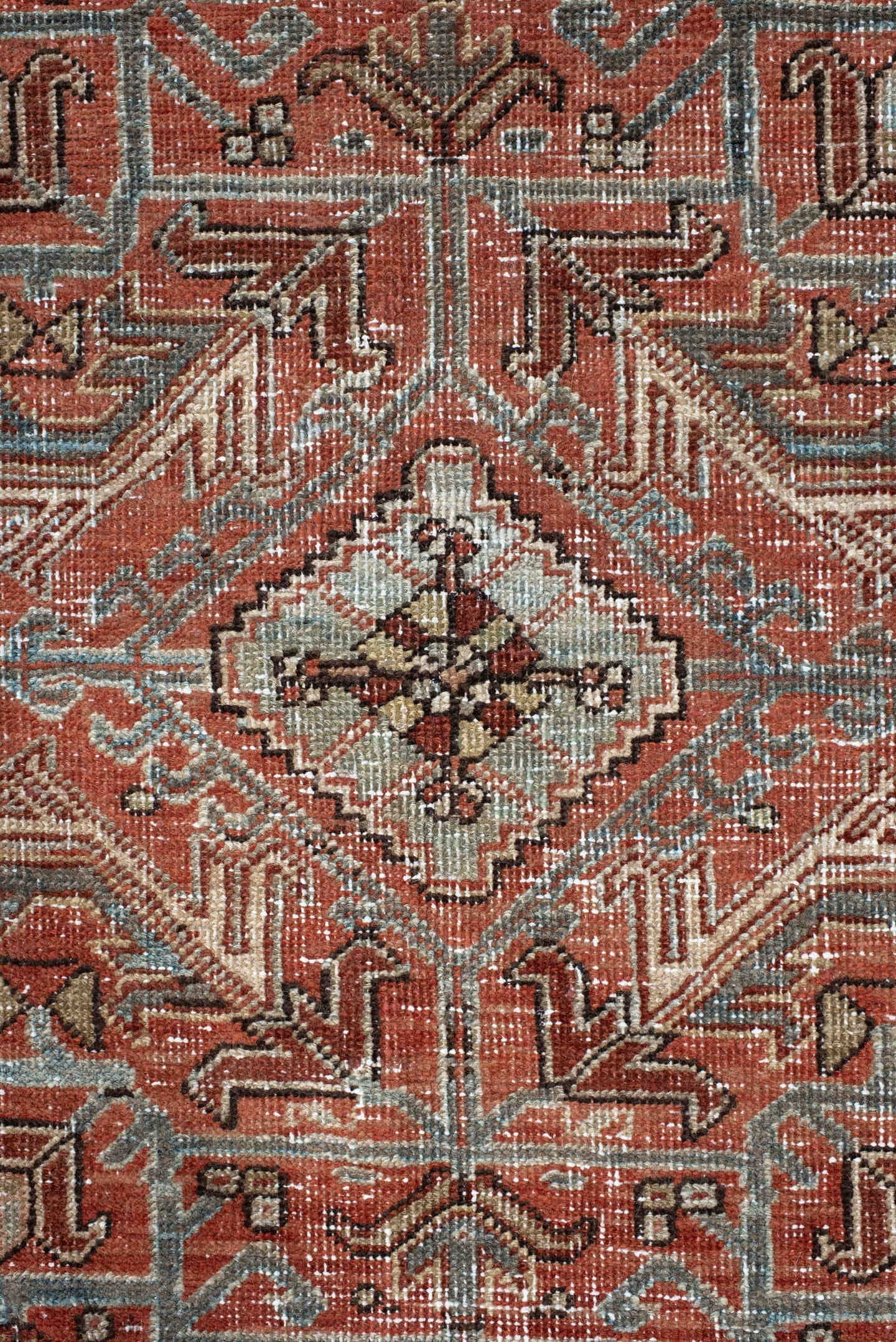 7' x 9' one-of-a-kind handmade antique Heriz large size rug. Color palette: terra cotta, ivory, slate, charcoal, rust, camel