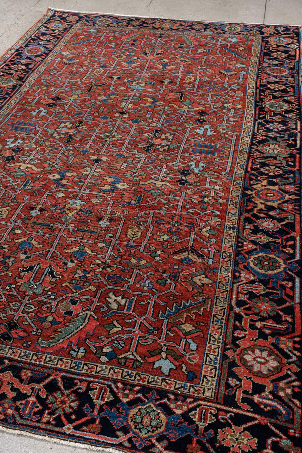 6' x 10' one-of-a-kind handmade antique Heriz large size rug. Color palette: rust, navy, ivory, sky_blue, sage, coral, camel