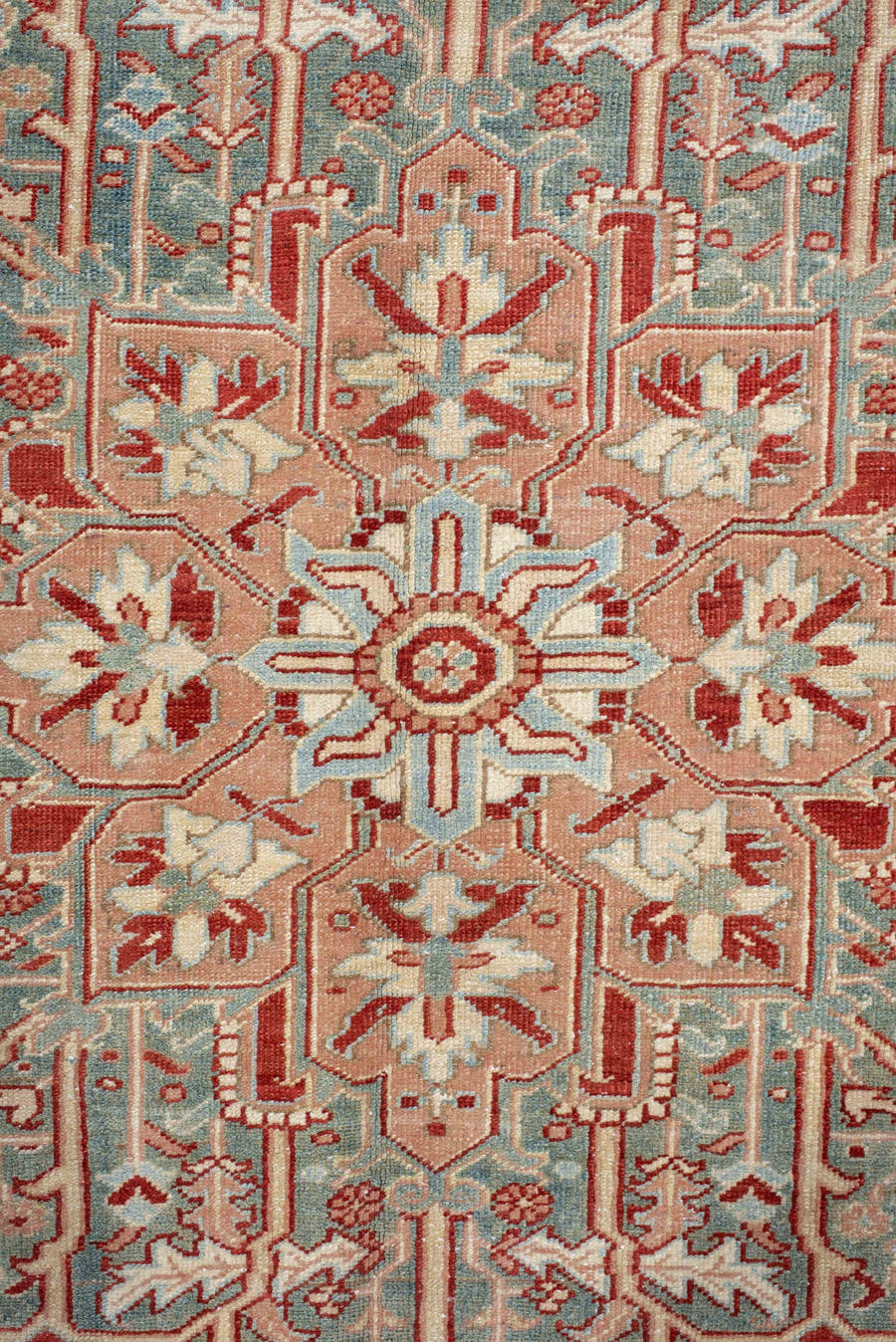 9' x 12' one-of-a-kind handmade antique Heriz large size rug. Color palette: rust, sky blue, ivory, terra cotta, sage, cream
