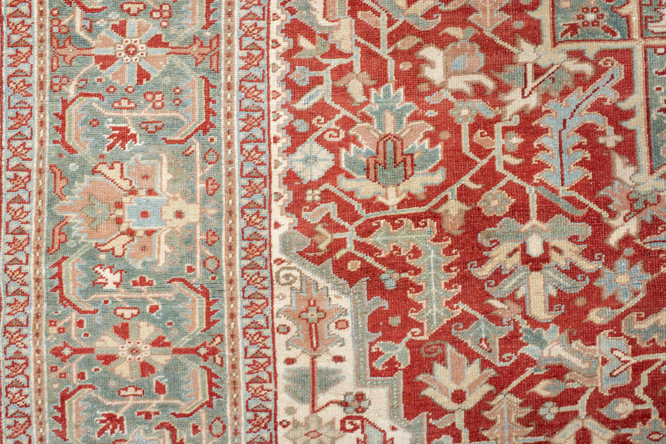 9' x 12' one-of-a-kind handmade antique Heriz large size rug. Color palette: rust, sky blue, ivory, terra cotta, sage, cream