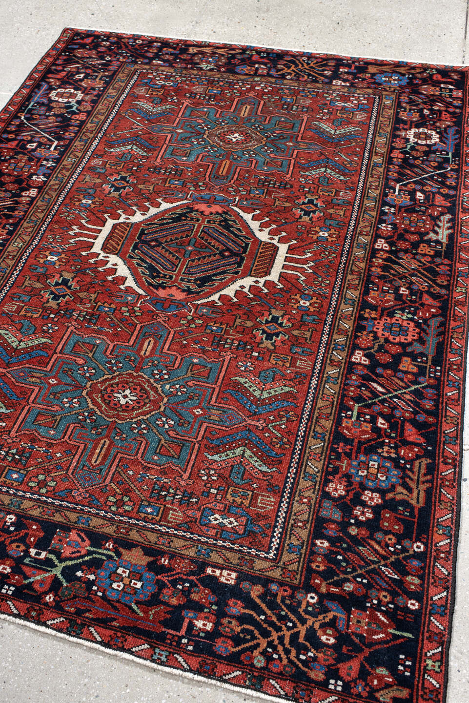 4' x 6' one-of-a-kind handmade vintage Karaje small size rug. Color palette: black, blue, brown, fire brick, gray, off-white