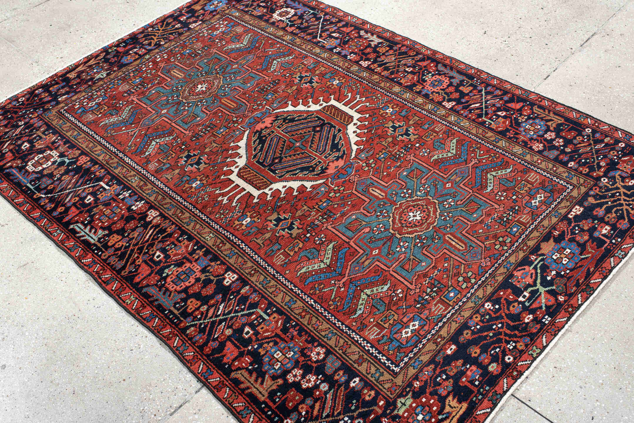 4' x 6' one-of-a-kind handmade vintage Karaje small size rug. Color palette: black, blue, brown, fire brick, gray, off-white
