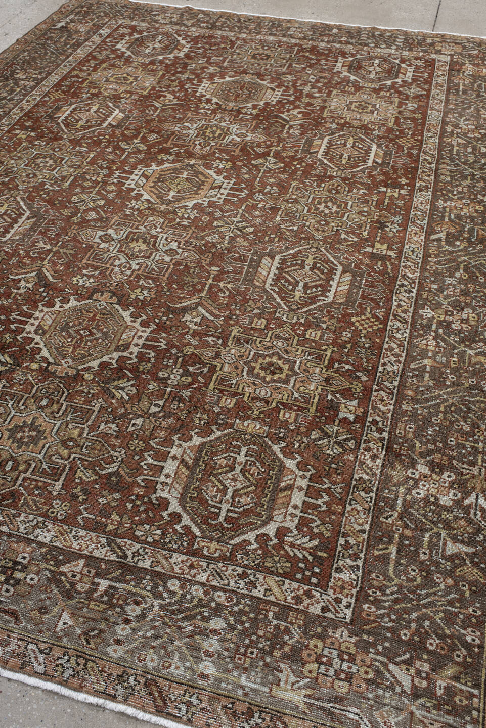 7' x 9' one-of-a-kind handmade vintage Karaje rug. Color palette: brown, gray, light gray, off-white