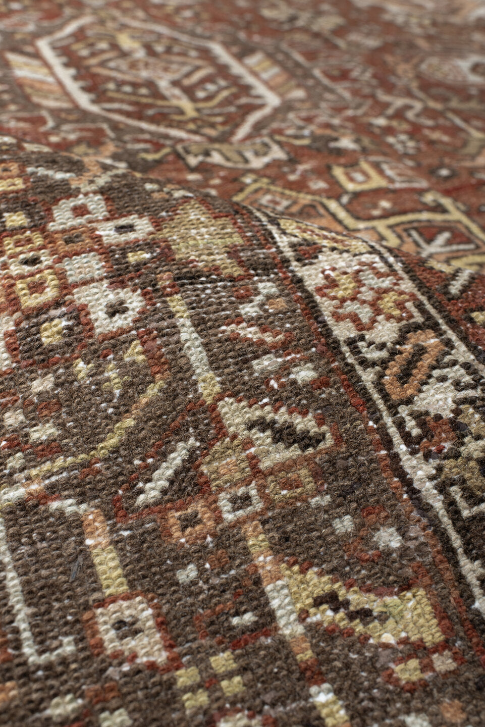 7' x 9' one-of-a-kind handmade vintage Karaje rug. Color palette: brown, gray, light gray, off-white