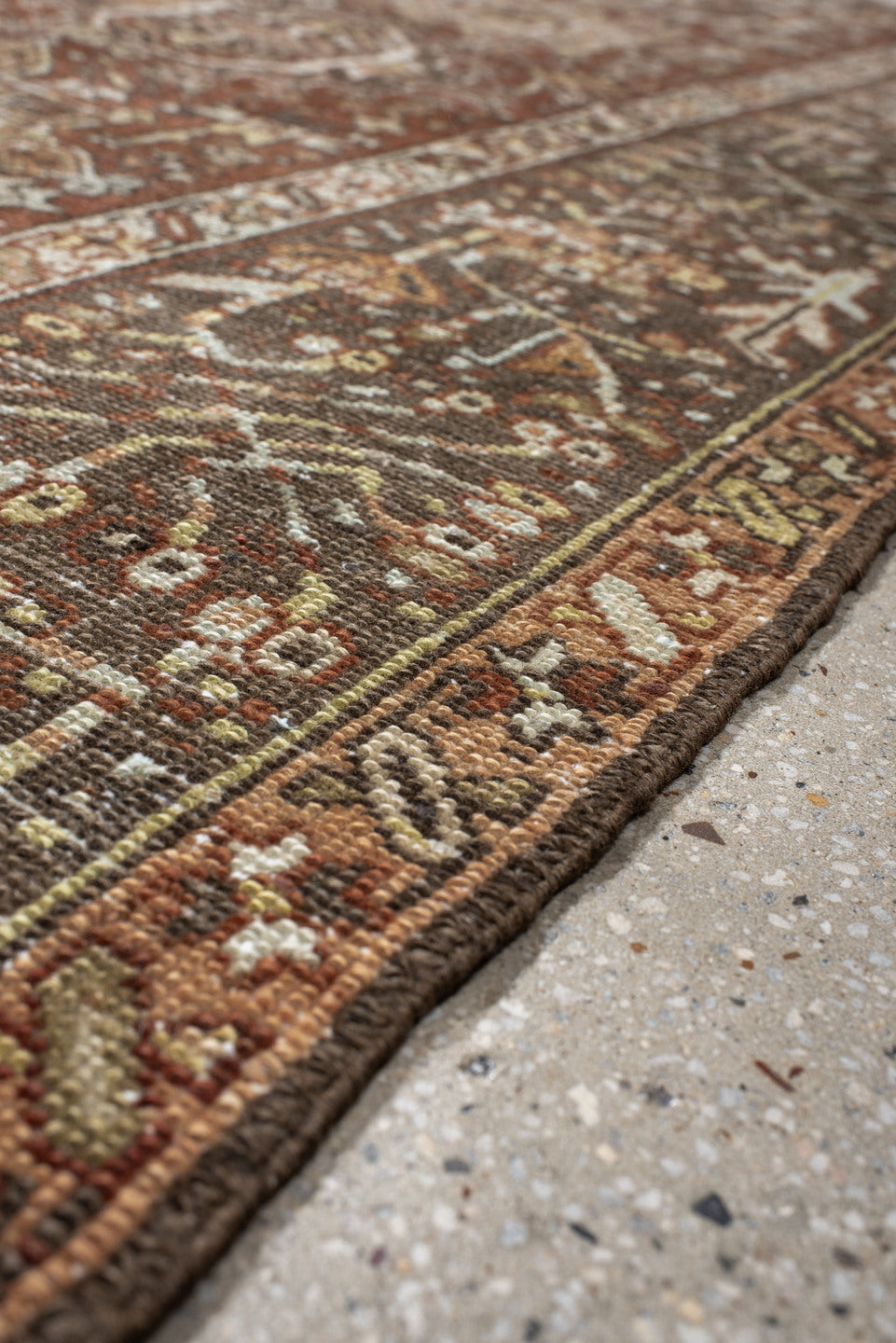 7' x 9' one-of-a-kind handmade vintage Karaje rug. Color palette: brown, gray, light gray, off-white