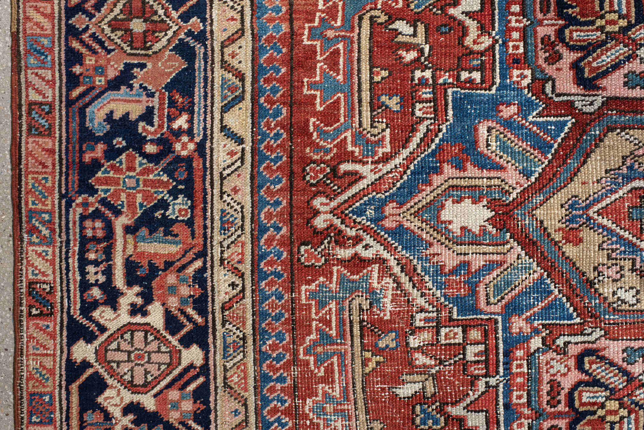 7' x 10' one-of-a-kind handmade antique Heriz large size rug. Color palette: rust, ivory, navy, sky_blue, brick, coral