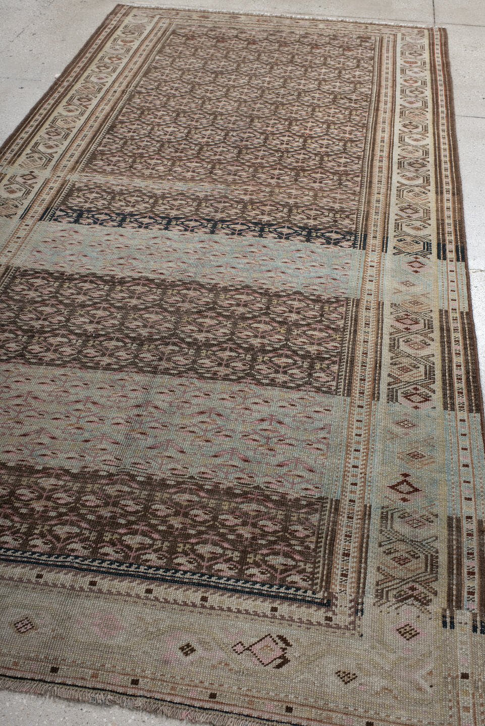 5' x 10' one-of-a-kind handmade antique NW Persian medium size rug. Color palette: ivory, brown, sky blue, taupe, rose, rust