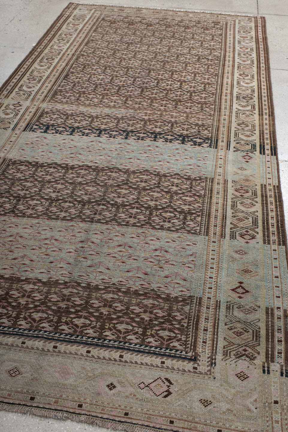 5' x 10' one-of-a-kind handmade antique NW Persian medium size rug. Color palette: ivory, brown, sky blue, taupe, rose, rust