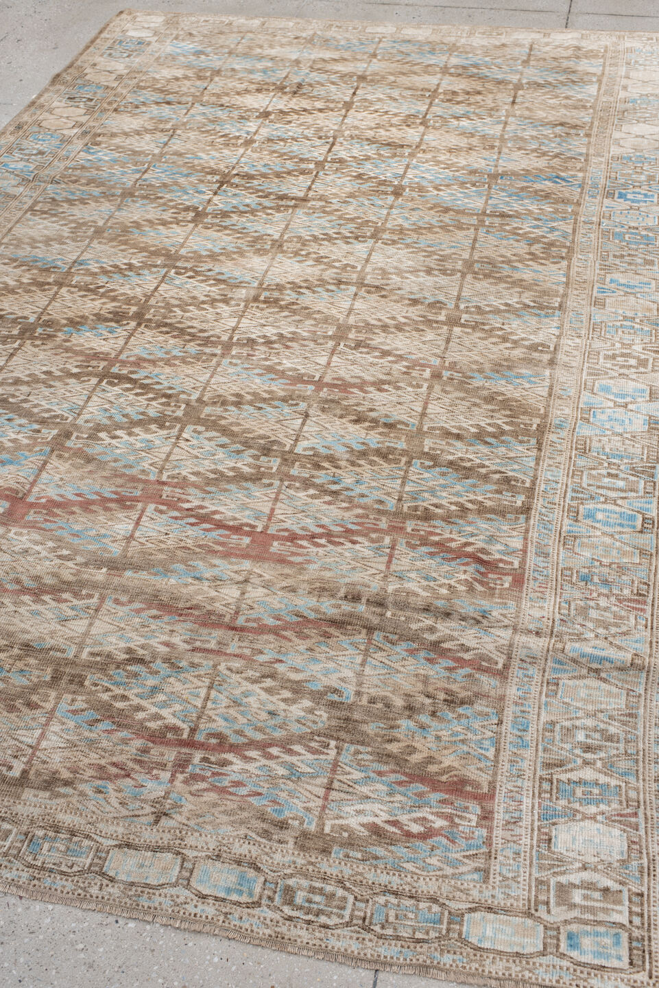 6' x 9' one-of-a-kind handmade antique Yamoud medium size rug. Color palette: ivory, taupe, camel, sky blue, brown, rose