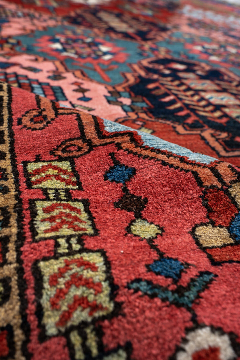 6' x 10' one-of-a-kind handmade antique Baktiary large size rug. Color palette: rust, indigo, rose, ivory, sky blue, navy