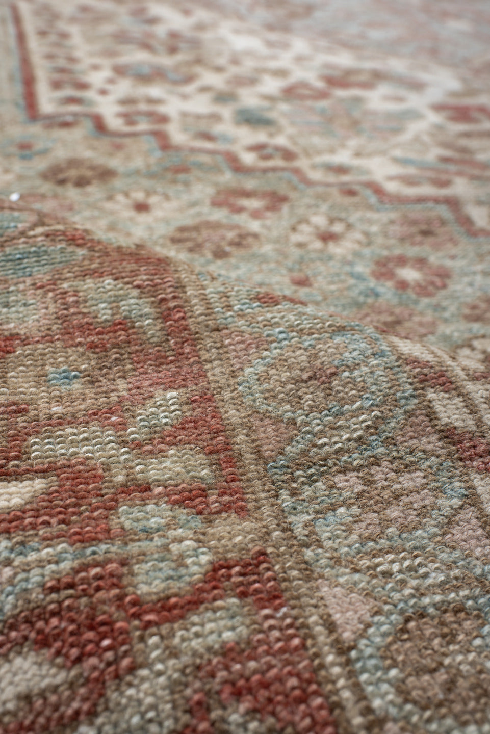 6' x 10' one-of-a-kind handmade antique Baktiary large size rug. Color palette: ivory, dusty blue, rose, taupe, terra cotta