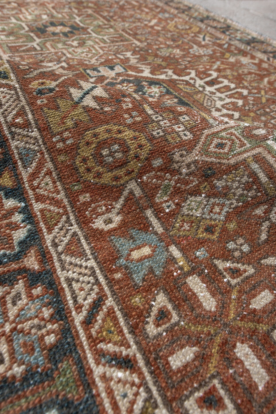 3' x 4' one-of-a-kind handmade antique Karaje small size rug. Color palette: rust, ivory, navy, sage, camel, gold