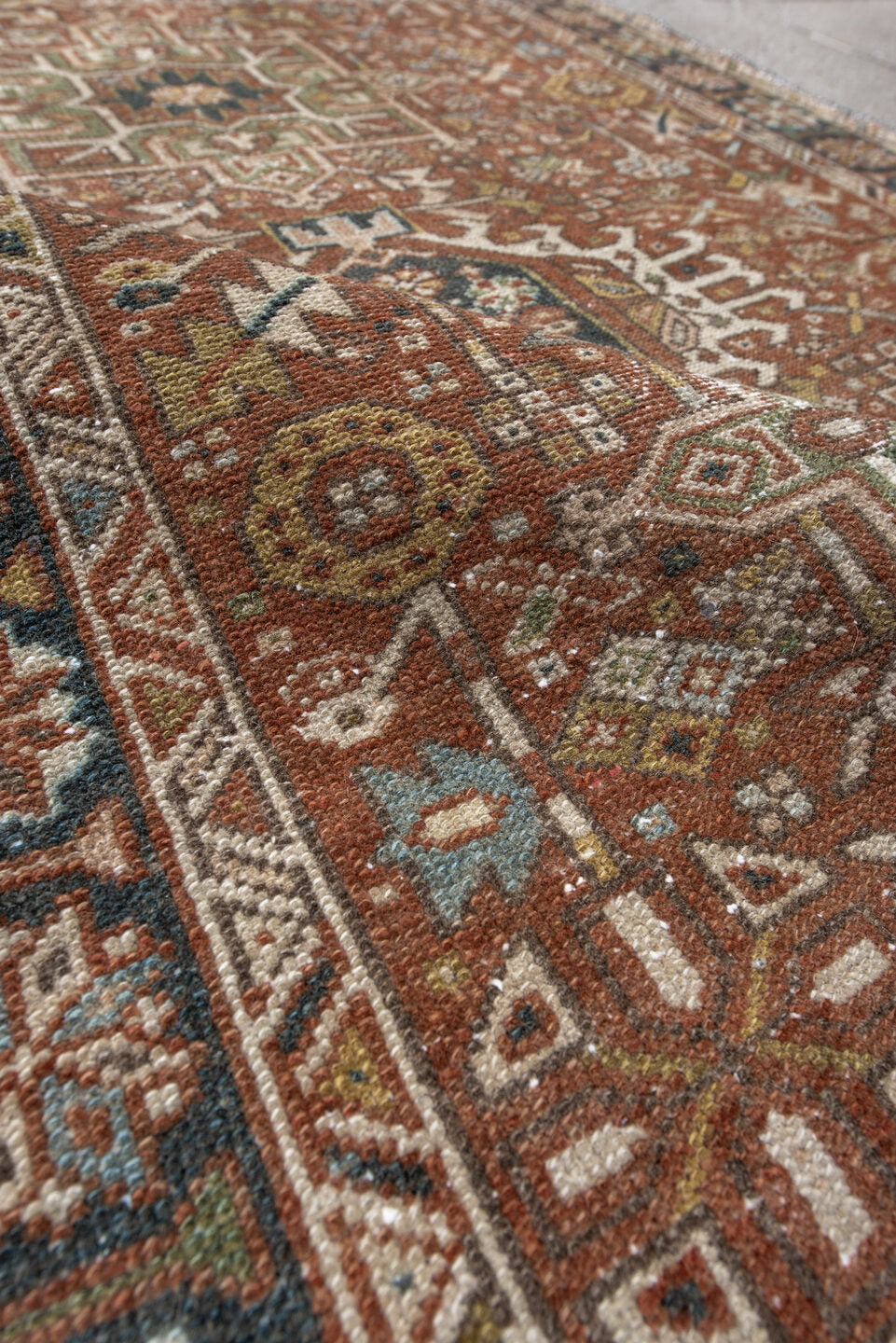 3' x 4' one-of-a-kind handmade antique Karaje small size rug. Color palette: rust, ivory, navy, sage, camel, gold