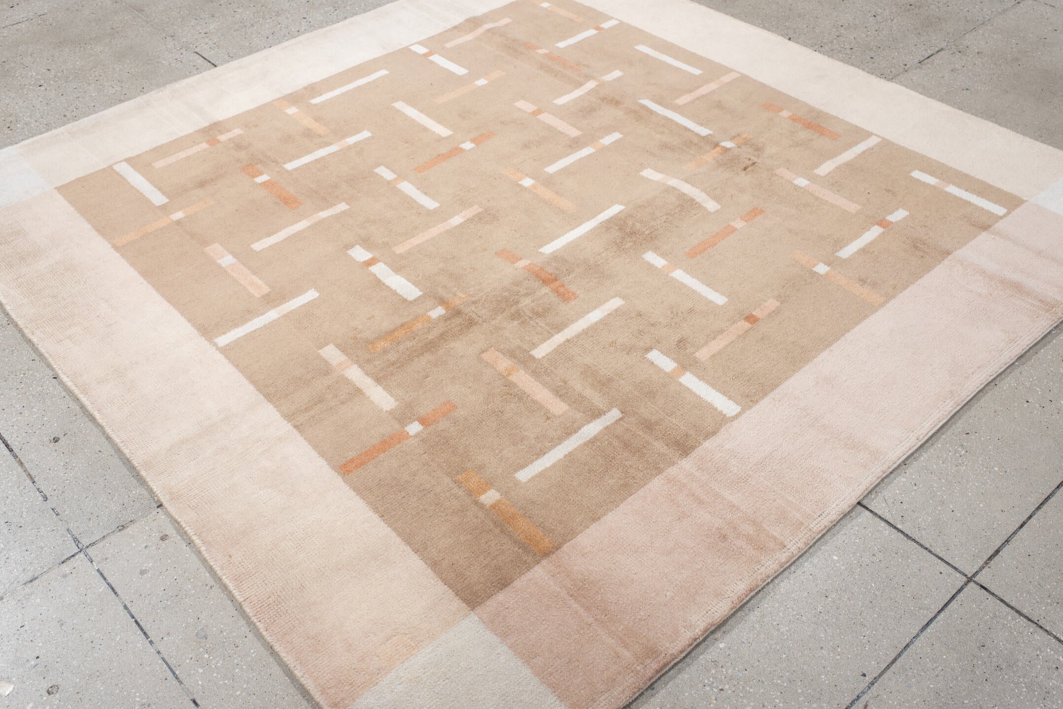 6' x 6' one-of-a-kind handmade handmade Modern rug. Color palette: taupe, ivory, blush, coral, beige, gray, pink, terracotta