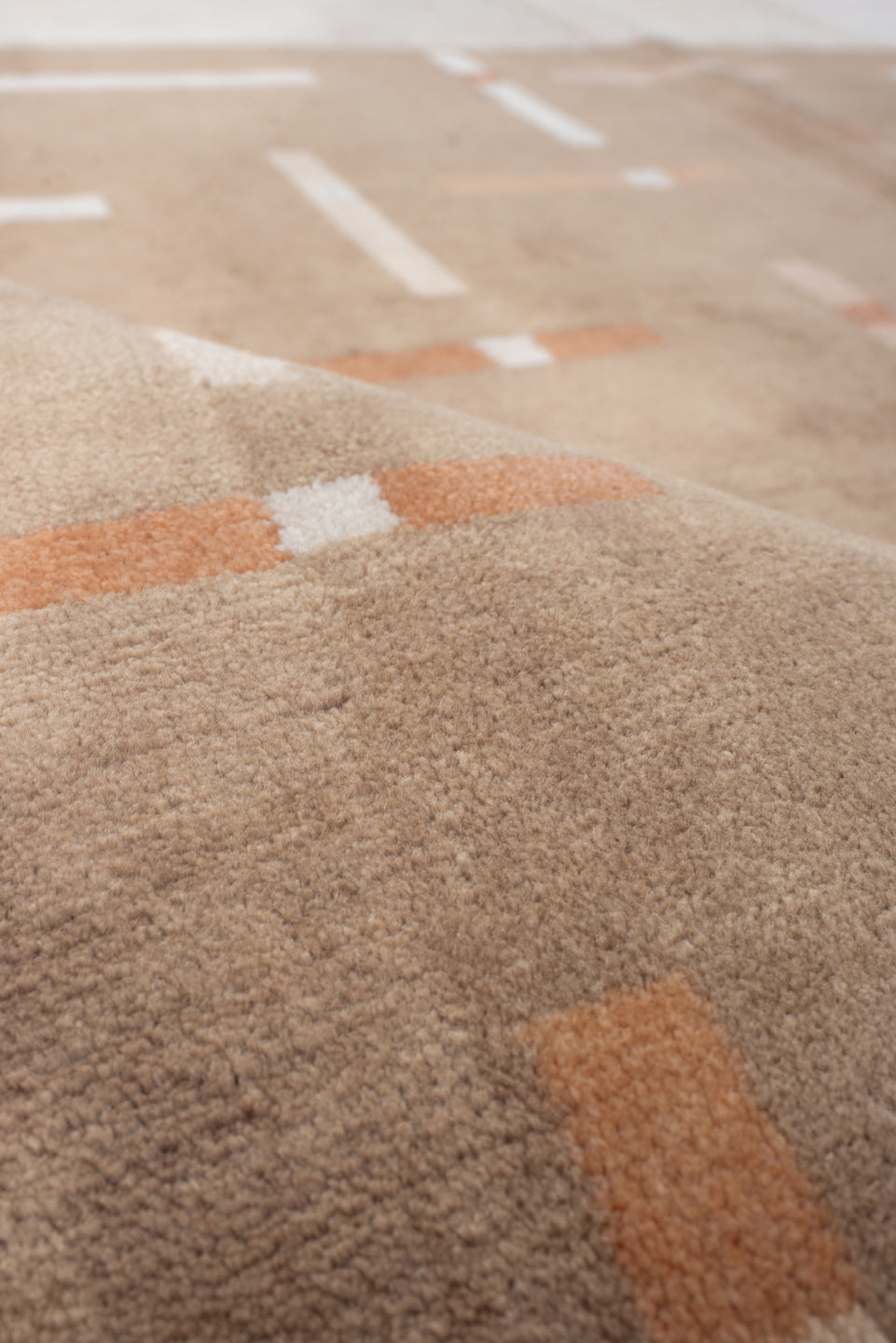 6' x 6' one-of-a-kind handmade handmade Modern rug. Color palette: taupe, ivory, blush, coral, beige, gray, pink, terracotta