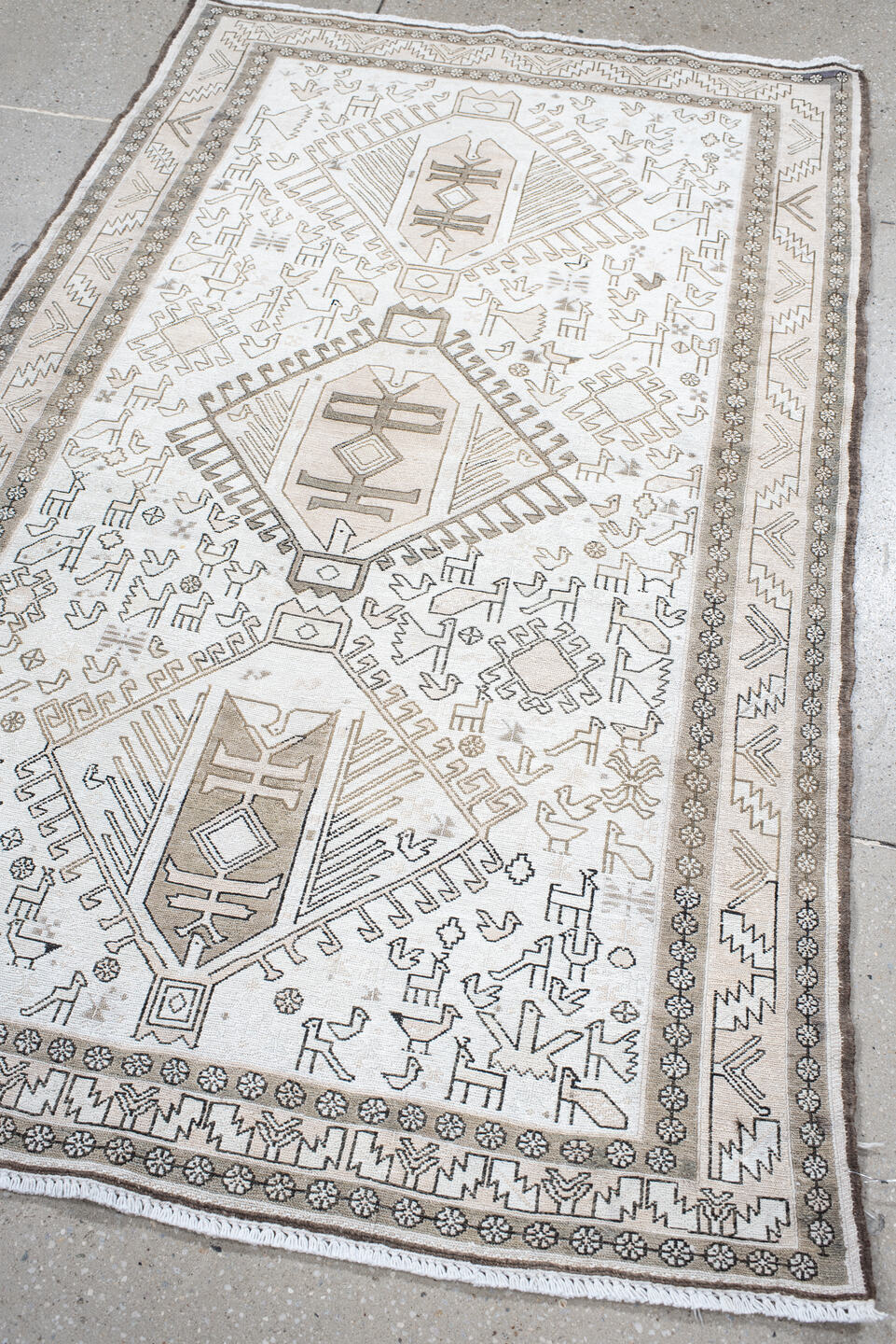 3' x 5' one-of-a-kind handmade antique Sumak small size rug. Color palette: ivory, taupe, brown, camel, gray, beige
