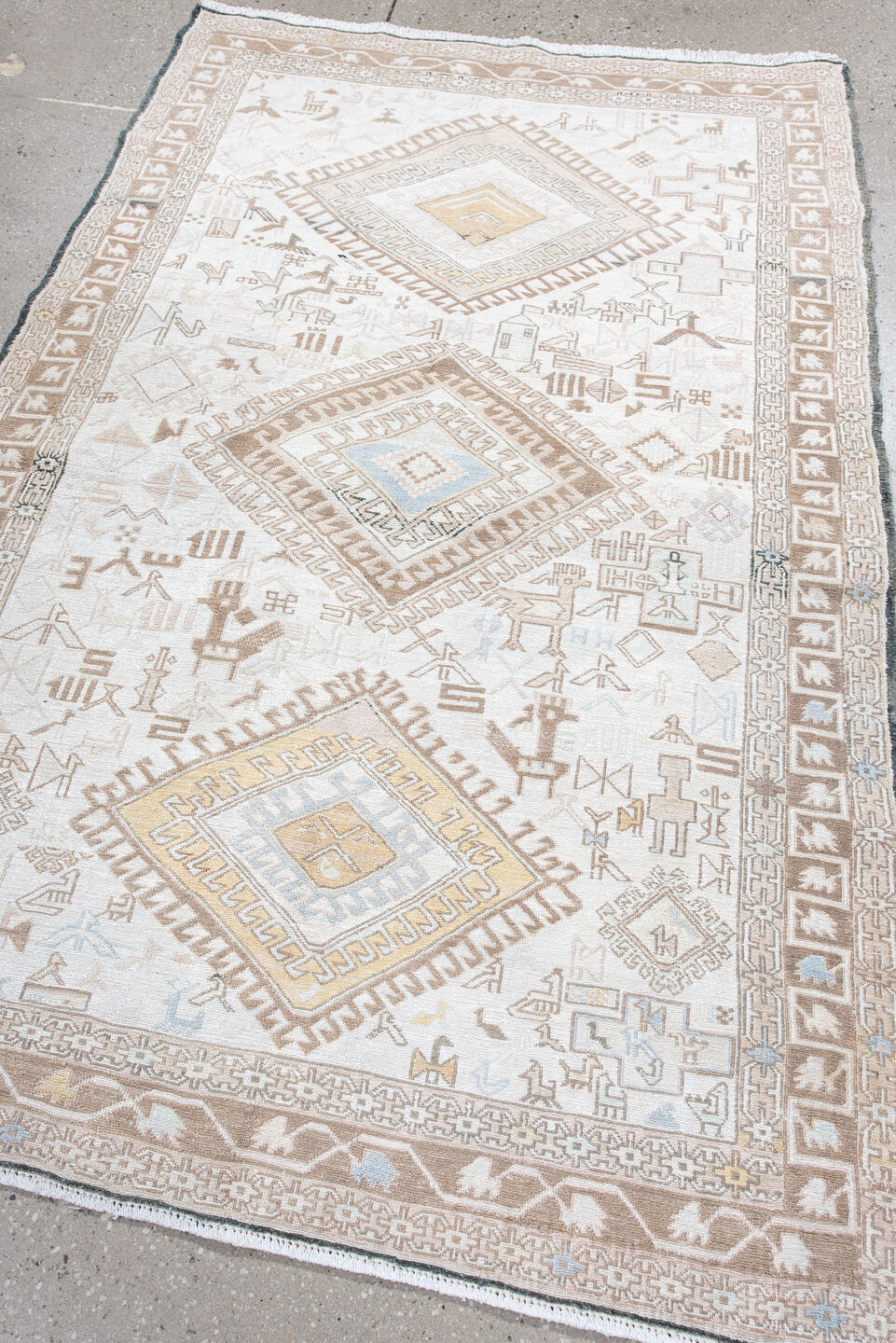 4' x 5' one-of-a-kind handmade antique Sumak small size rug. Color palette: ivory, camel, taupe, pale blue, soft gold, beige