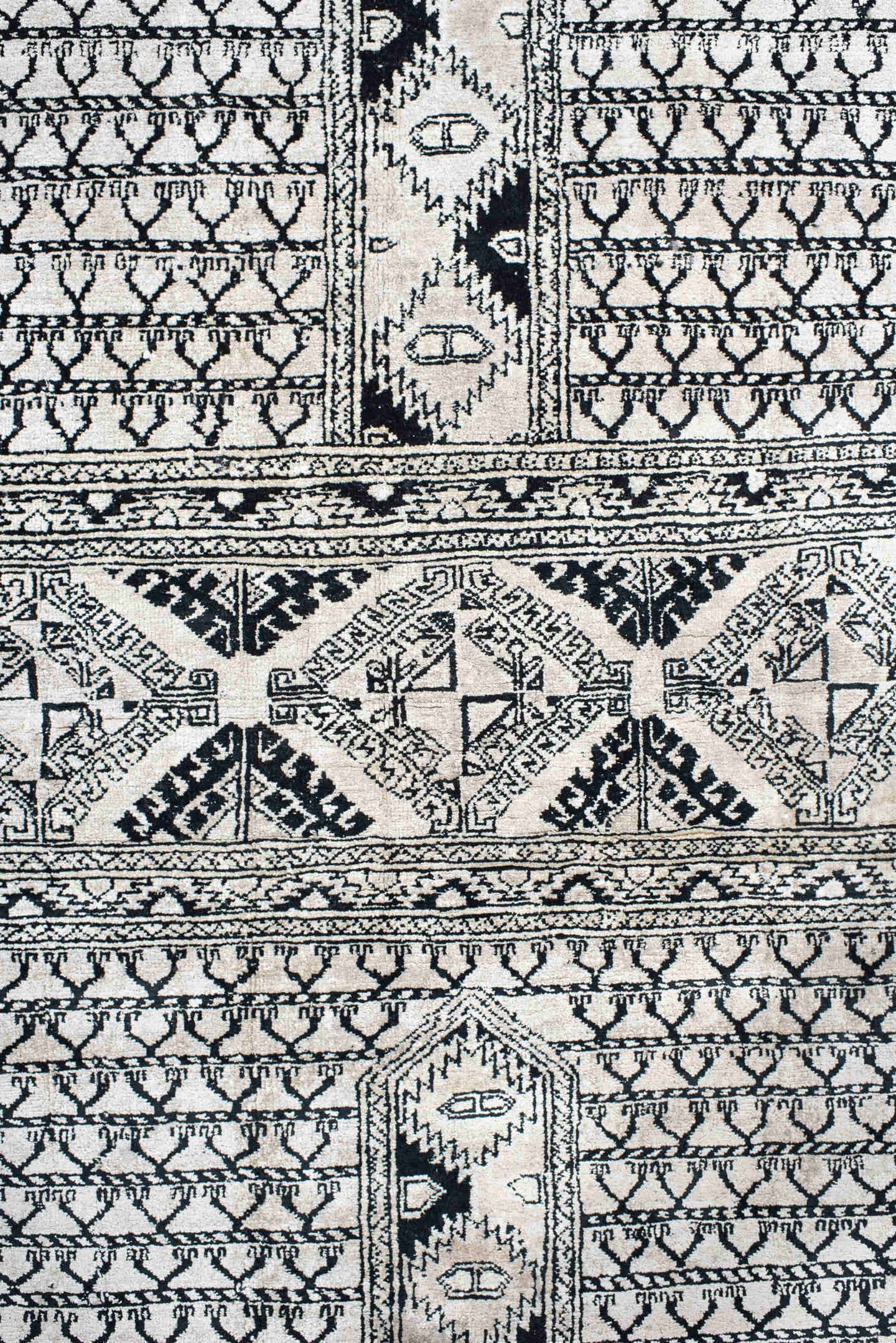 3' x 5' one-of-a-kind handmade vintage Afghan small size rug. Color palette: ivory, charcoal, black, gray