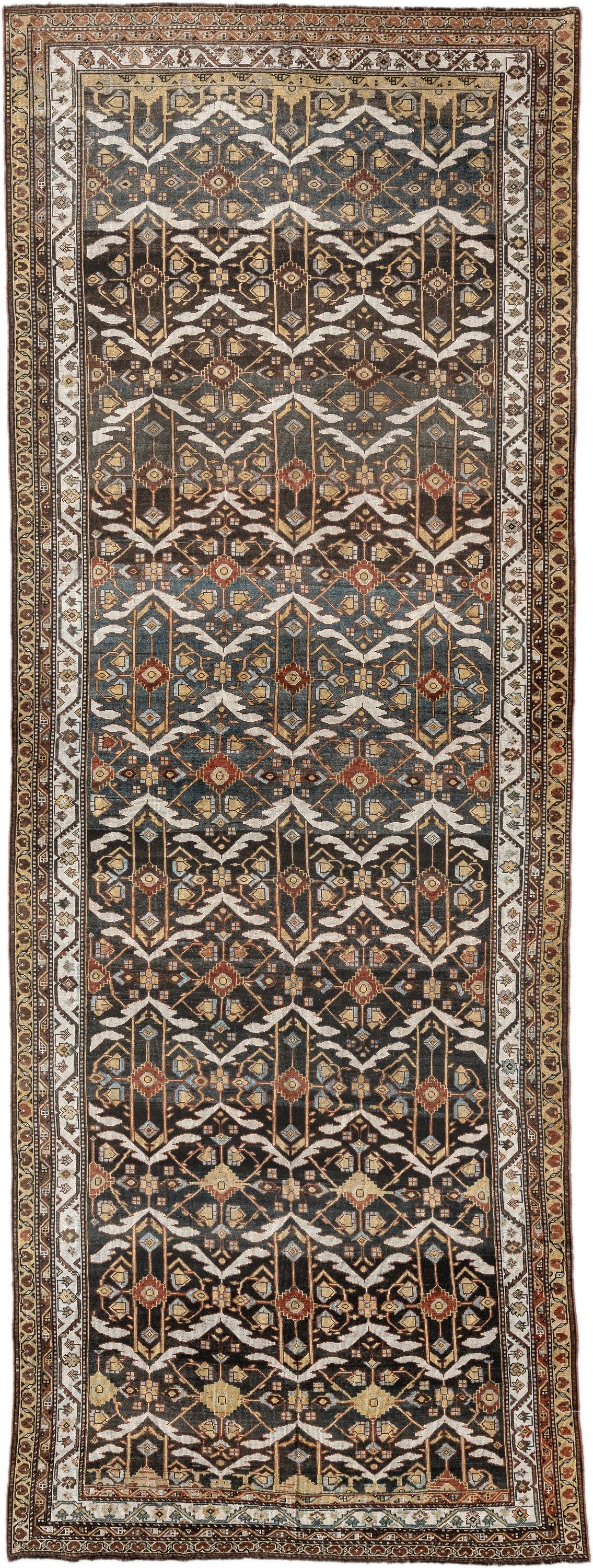 5' x 14' one-of-a-kind handmade antique Baktiary rug. Color palette: brown, ivory, camel, slate, rust, gold, charcoal