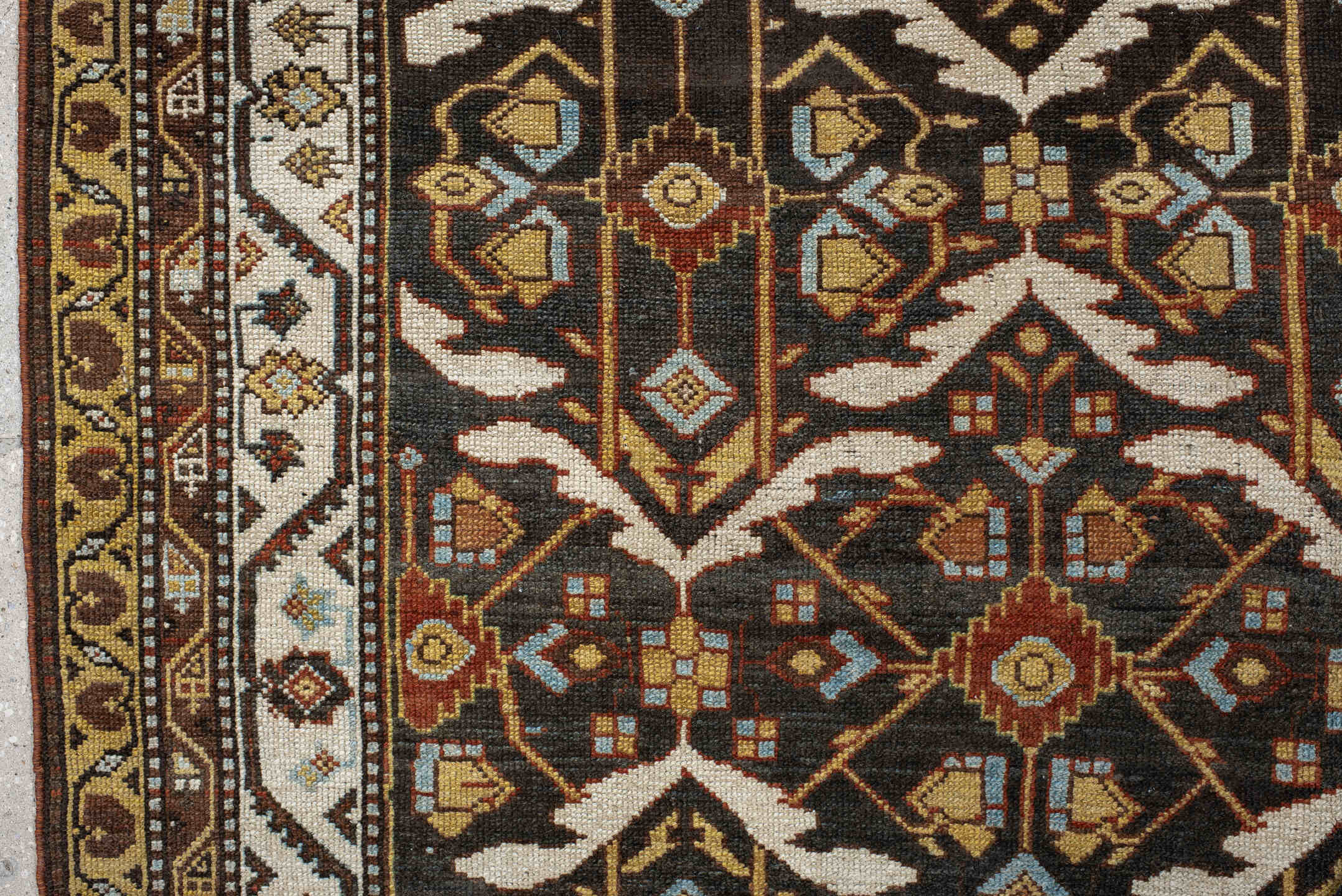 5' x 14' one-of-a-kind handmade antique Baktiary rug. Color palette: brown, ivory, camel, slate, rust, gold, charcoal