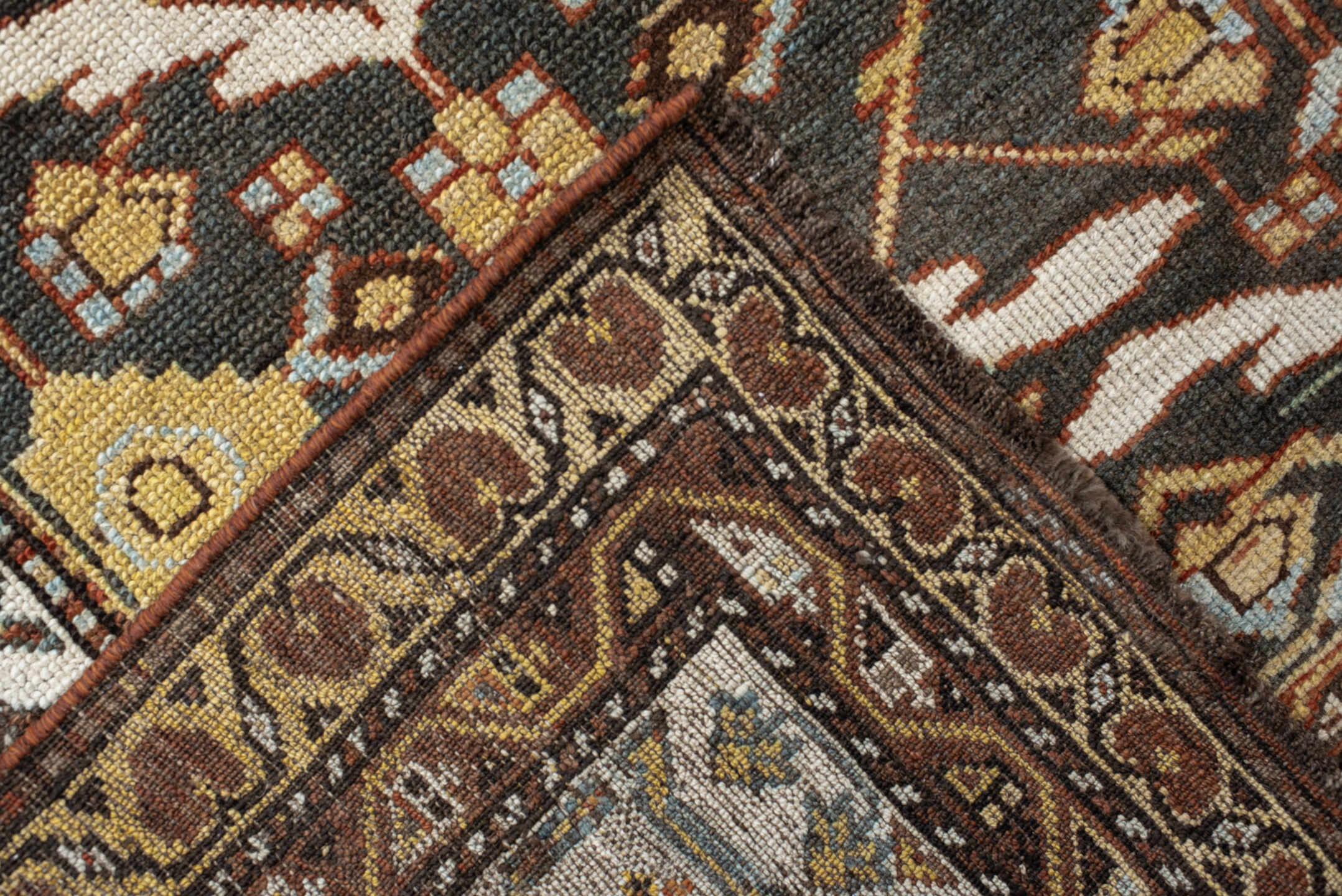 5' x 14' one-of-a-kind handmade antique Baktiary rug. Color palette: brown, ivory, camel, slate, rust, gold, charcoal