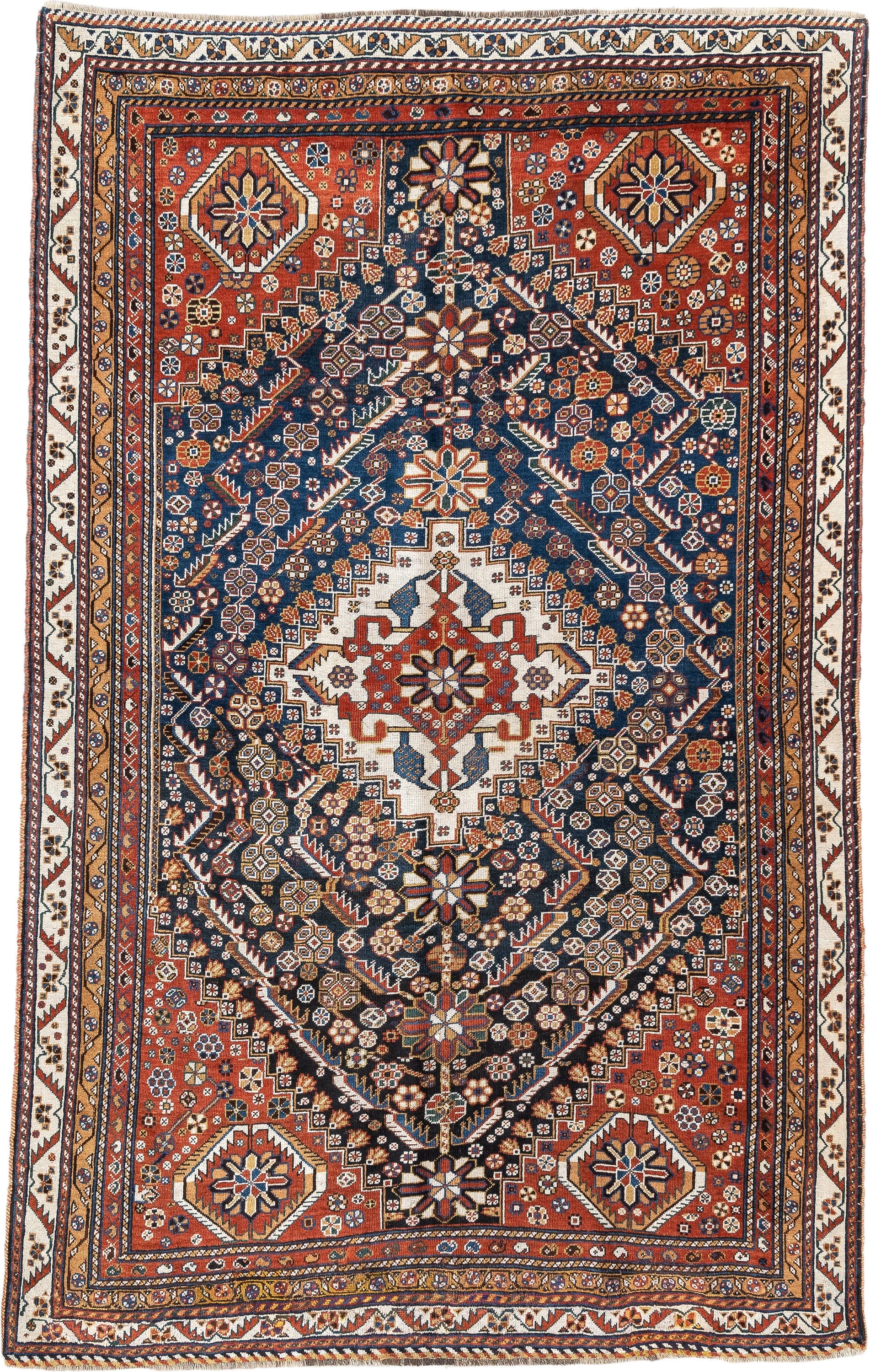 4' x 8' one-of-a-kind handmade vintage Shirvan medium size rug. Color palette: rust, navy, ivory, camel, saffron, indigo
