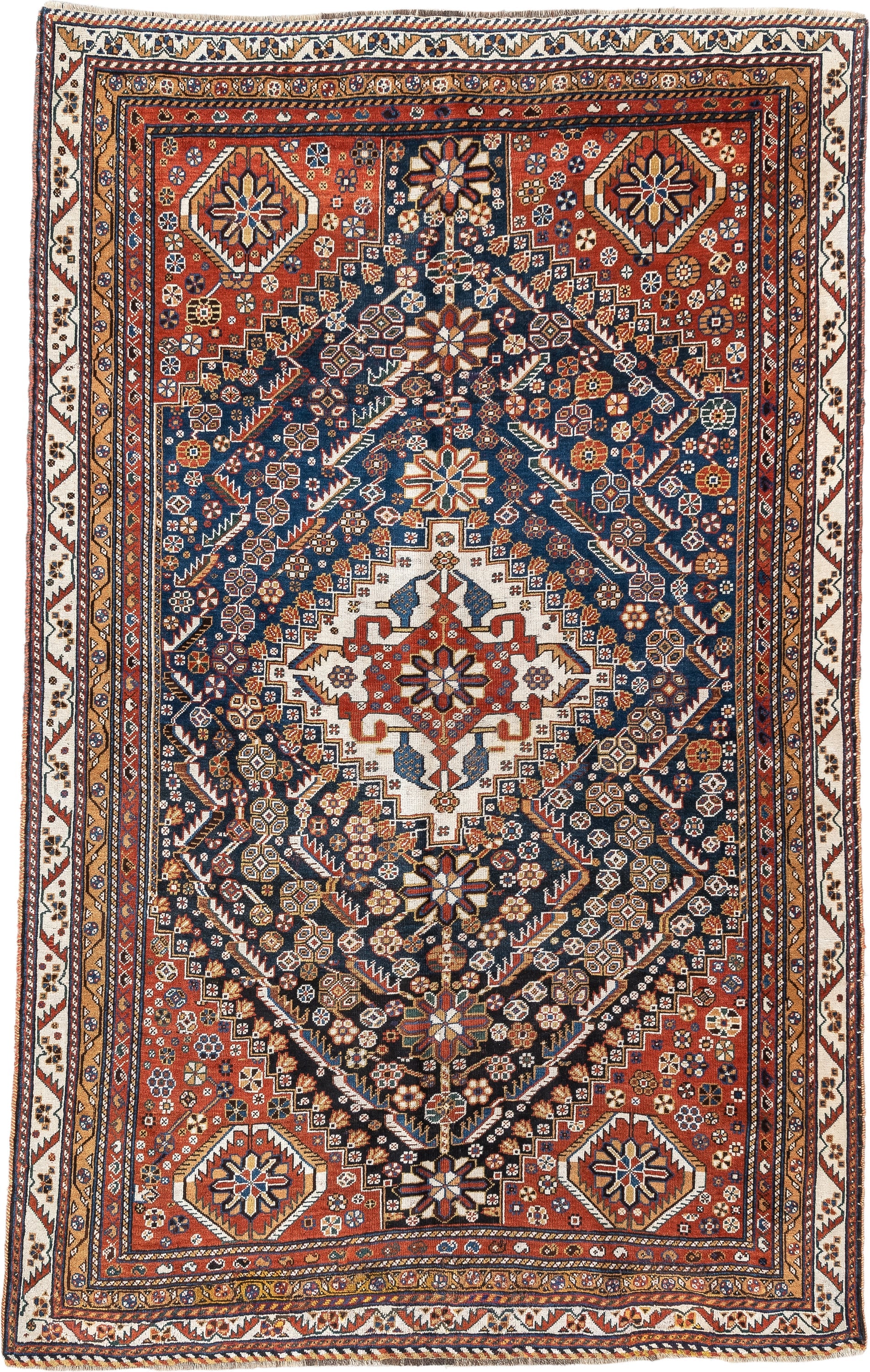 4' x 8' one-of-a-kind handmade vintage Shirvan medium size rug. Color palette: rust, navy, ivory, camel, saffron, indigo